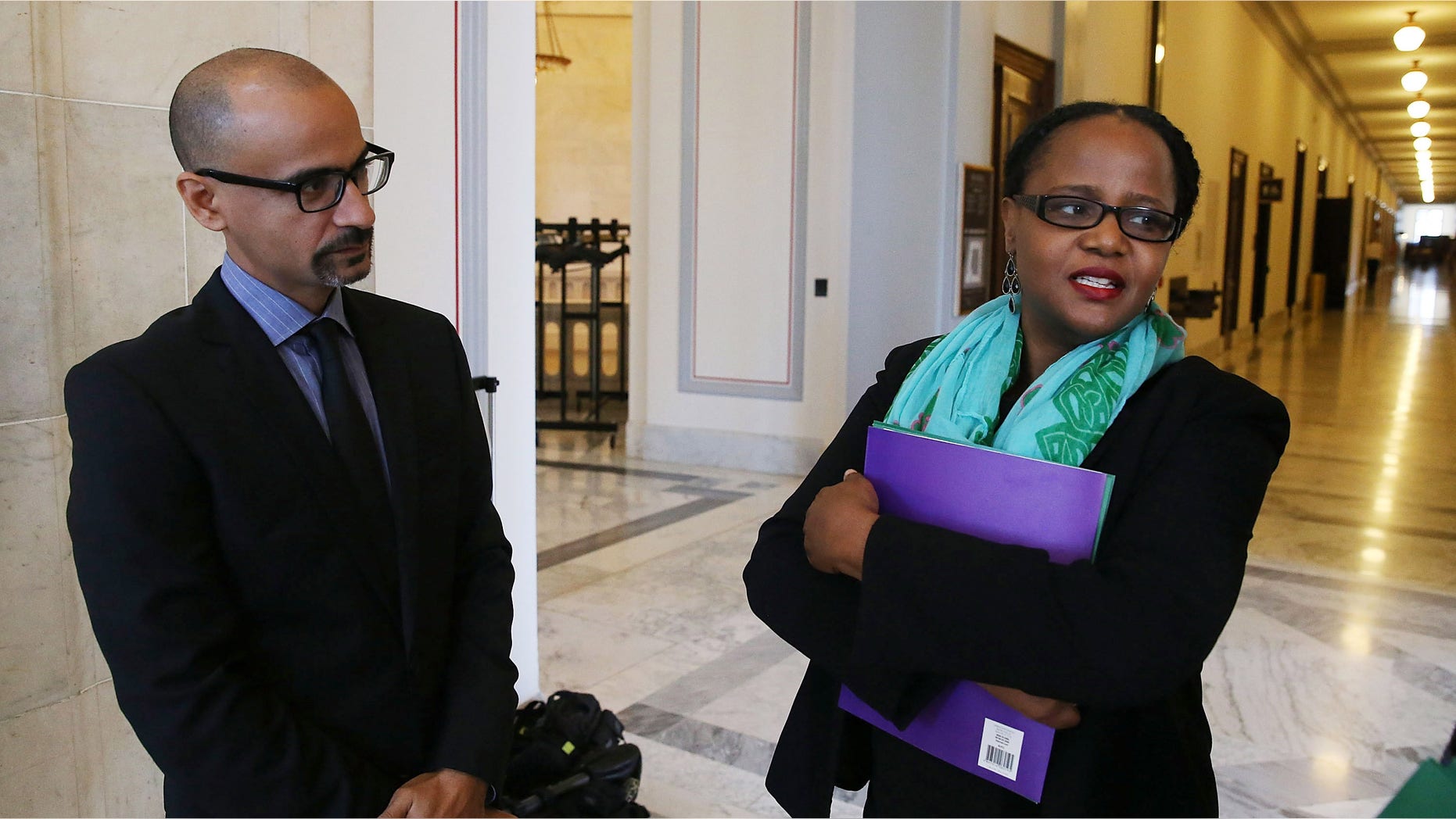 WASHINGTON, DC - OCTOBER 21: Award winning writers Junot Diaz (L) and writer Edwidge Danticat (R) talk after meeting with members of Congress on Capitol Hill, October 21, 2015 in Washington, DC. The renowned writers called on Congress and congressional staff to push the U.S. government into applying pressure to end this human rights crisis in the Dominican Republic that is wreaking havoc on hundreds of thousands lives. (Photo by Mark Wilson/Getty Images)
