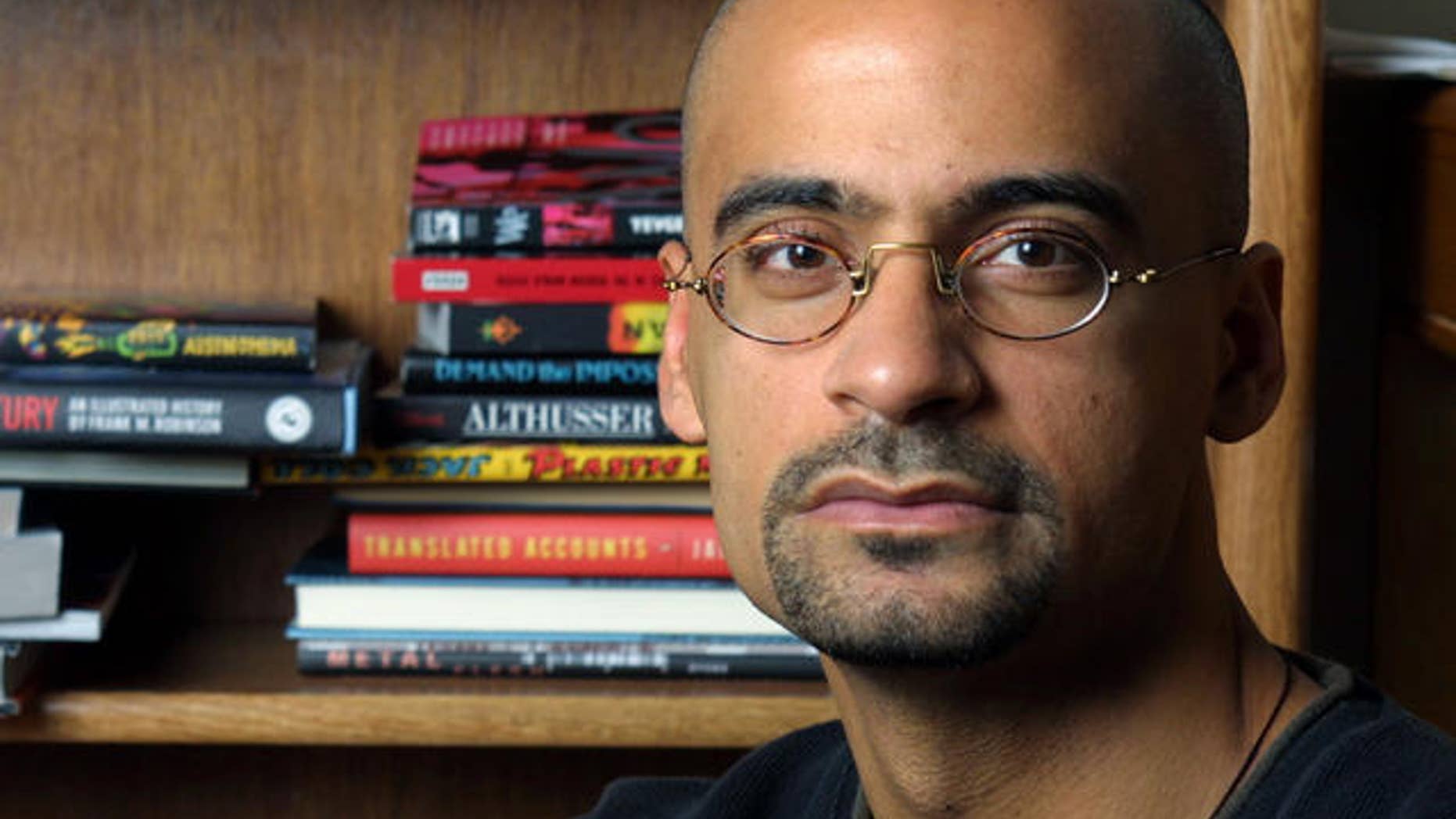 ** FILE ** Writer and Syracuse University professor Junot Diaz poses for a portrait in his Syracuse, N.Y., apartment Nov. 7, 2001. Diaz was awarded the Pulitzer for Fiction for "The Brief Wondrous Life of Oscar Wao." (AP Photo/Jim McKnight,File)