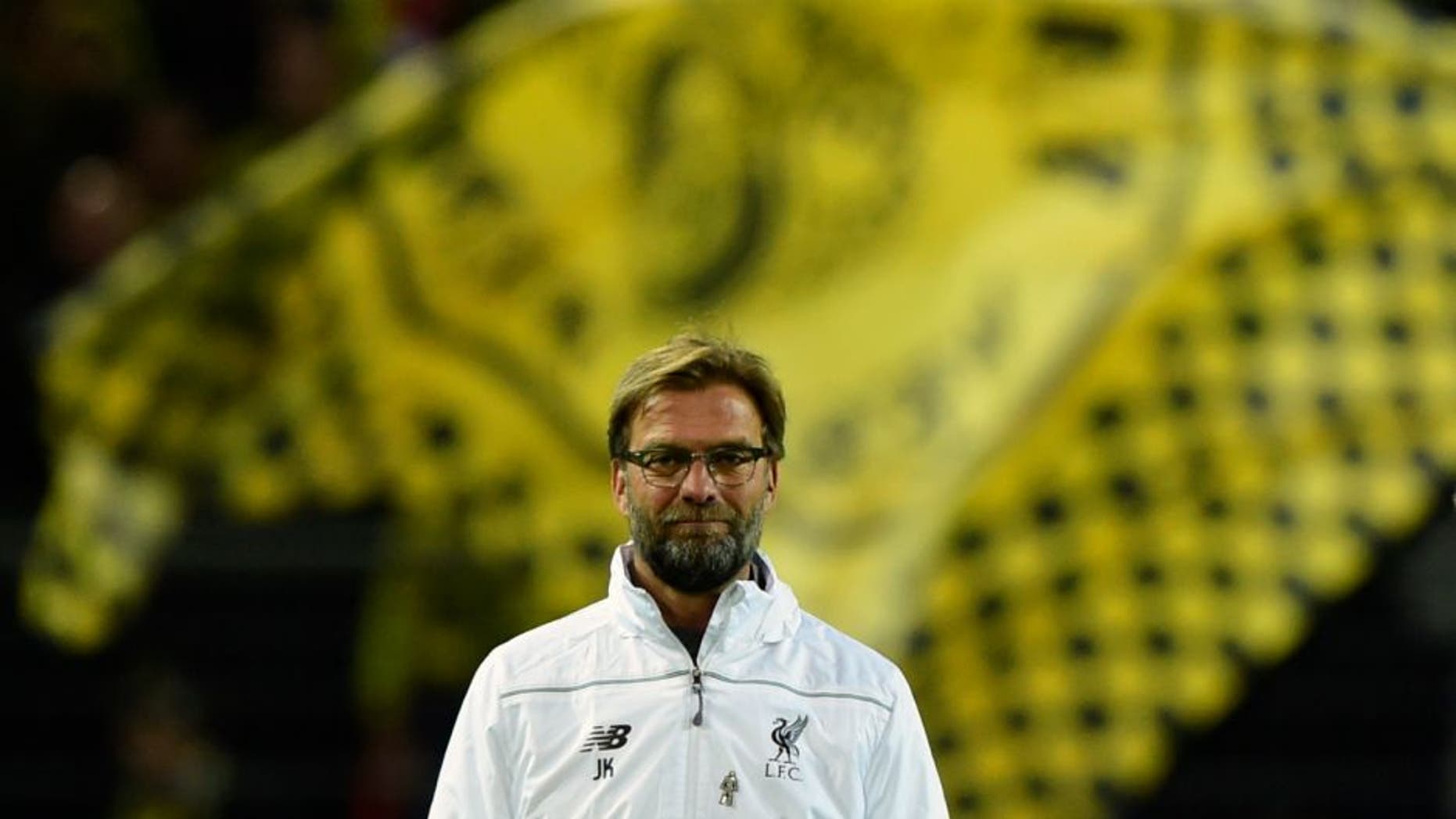 Liverpool's German head coach Jurgen Klopp follows the warm up prior to the UEFA Europe League quarter-final, first-leg football match Borussia Dortmund vs Liverpool FC in Dortmund, western Germany on April 7, 2016. / AFP / John MACDOUGALL (Photo credit should read JOHN MACDOUGALL/AFP/Getty Images)