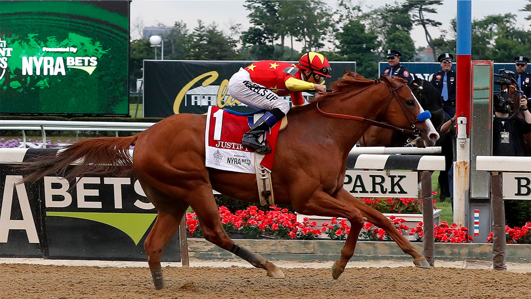 Justify (1), with jockey Mike Smith, crosses the finish line to win the 150th running of the Belmont Stakes horse race, Saturday, June 9, 2018, in Elmont, N.Y.