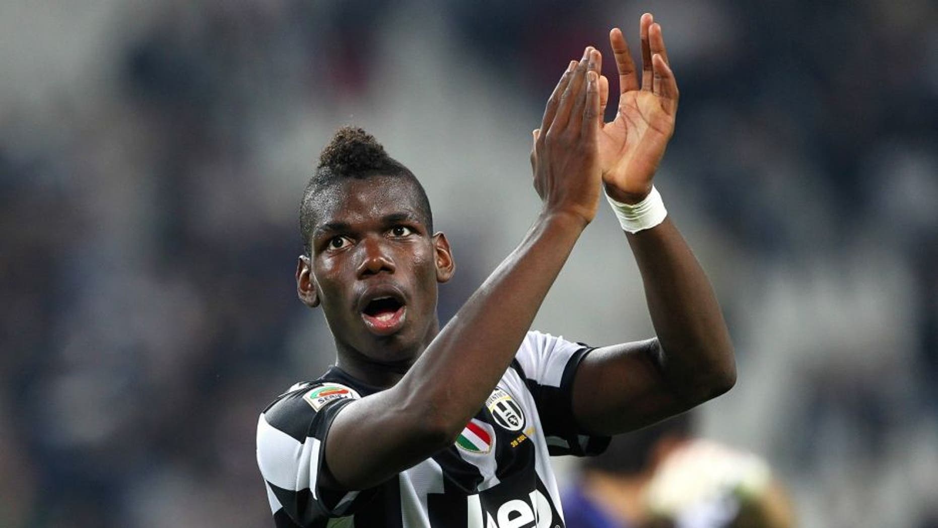 TURIN, ITALY - SEPTEMBER 22: Paul Pogba of FC Juventus salutes the crowd at the end of the Serie A match between FC Juventus v AC Chievo Verona at Juventus Arena on September 22, 2012 in Turin, Italy. (Photo by Marco Luzzani/Getty Images)