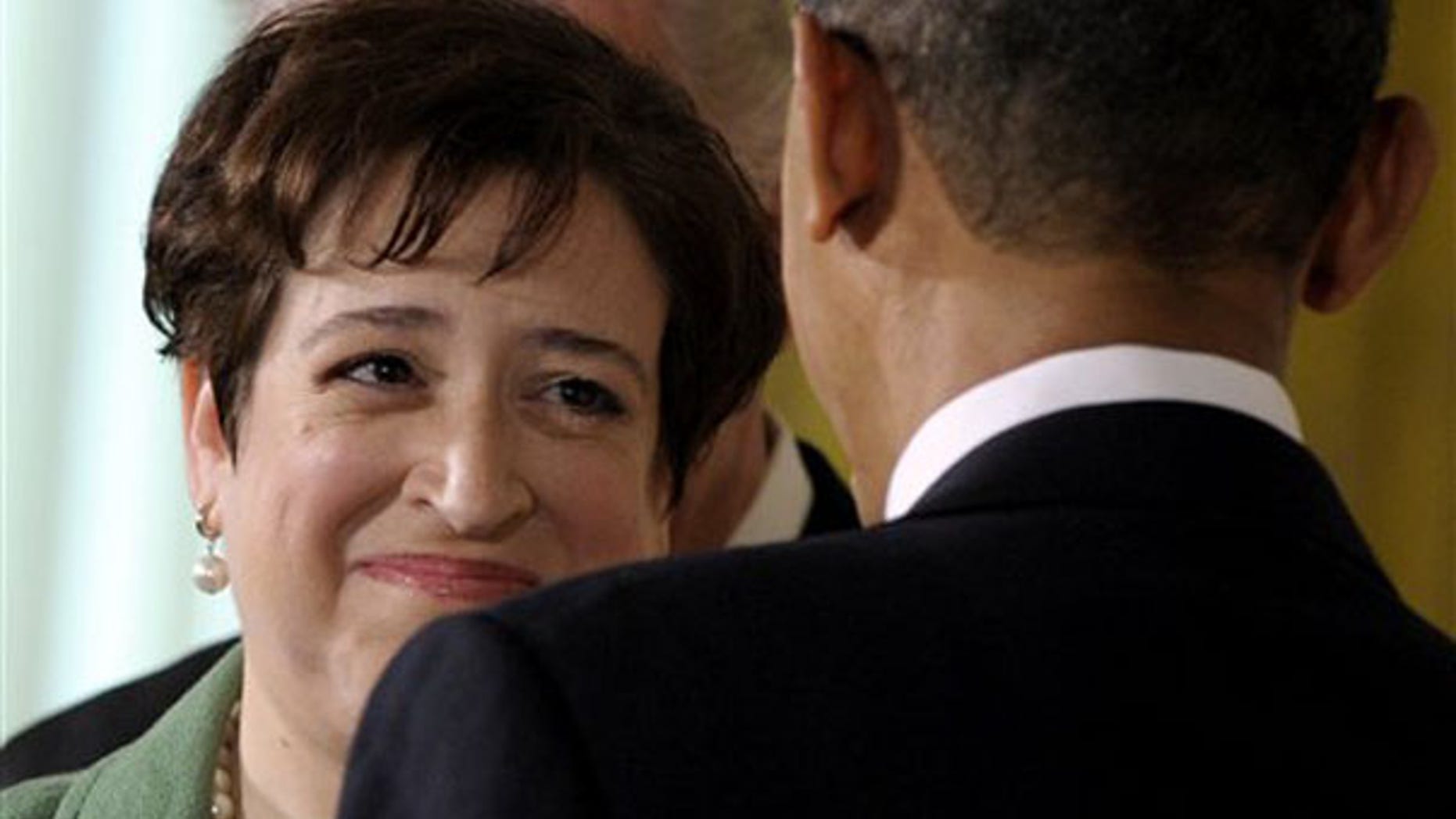 Monday: Elena Kagan looks to President Obama as she speaks in the East Room of the White House after being nominated to the U.S. Supreme Court. (AP Photo)