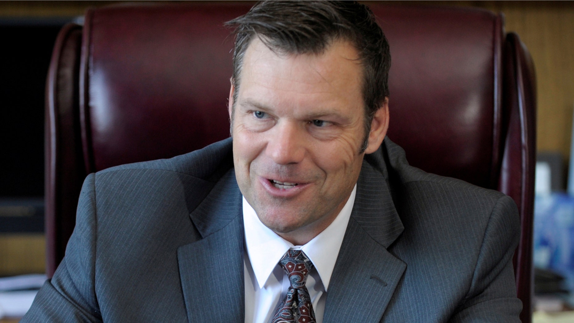 Kansas Secretary of State Kris Kobach talks about the Kansas voter ID law that he pushed to combat what he believes to be rampant voter fraud in the United States in his Topeka, Kansas, U.S., office May 12, 2016. REUTERS/Dave Kaup TPX IMAGES OF THE DAY - D1BETHJUBZAA