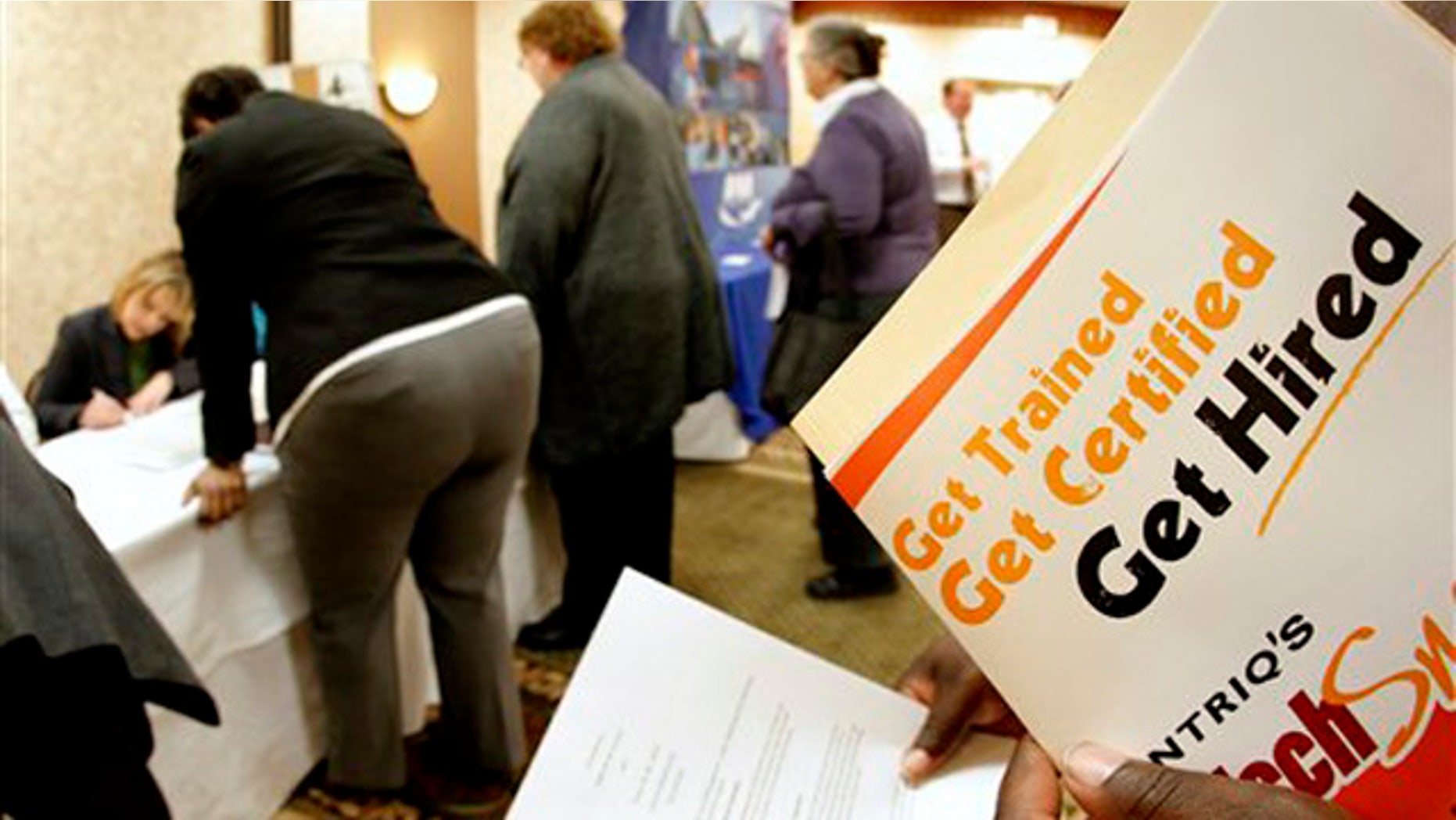 Dec. 1, 2011: Job seekers attend a career fair in Overland Park, Kan.