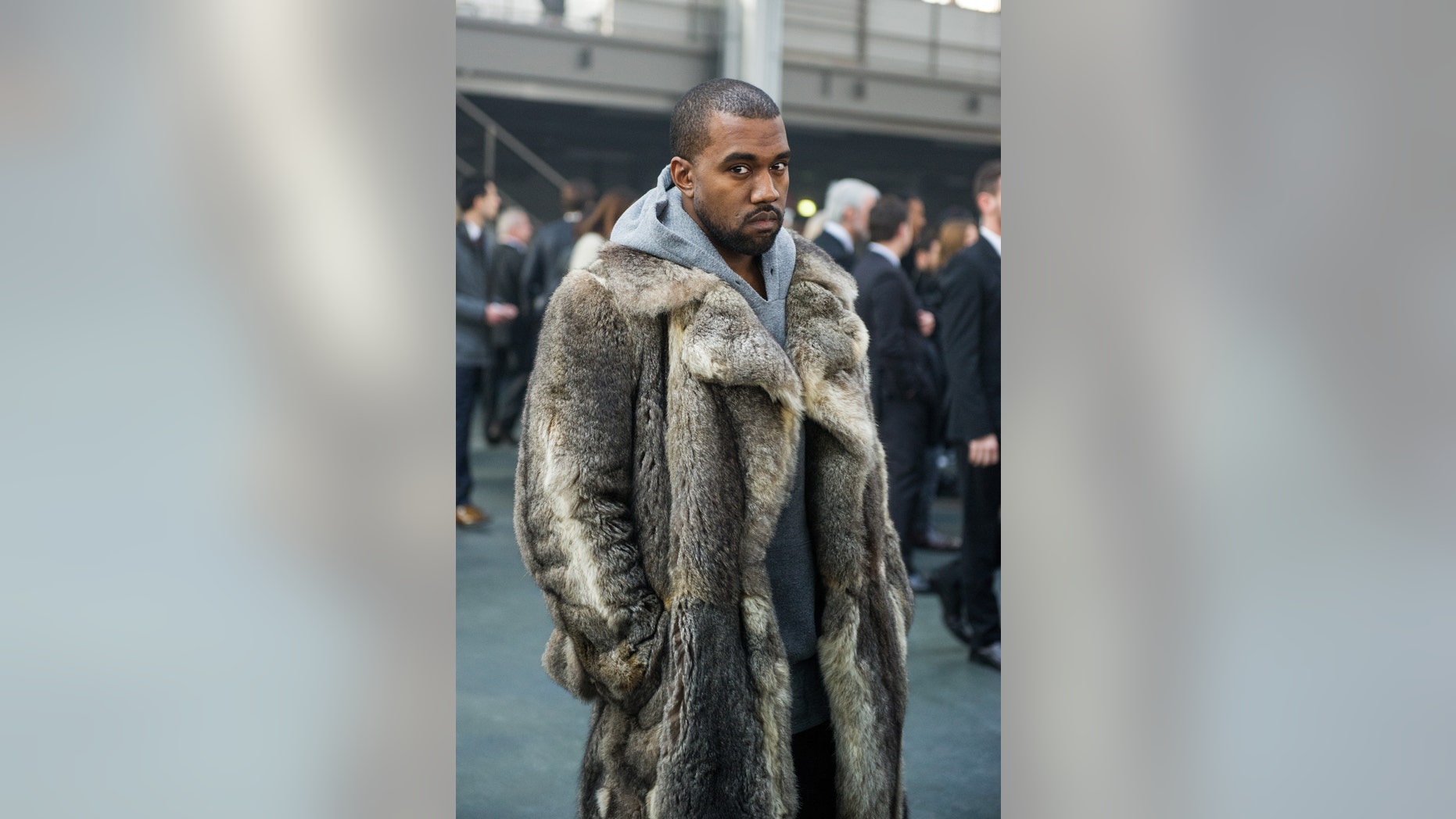 Jan. 17, 2014. Kanye West arriving at the Givenchy men's Fall-Winter 2014-2015 fashion collection in Paris.