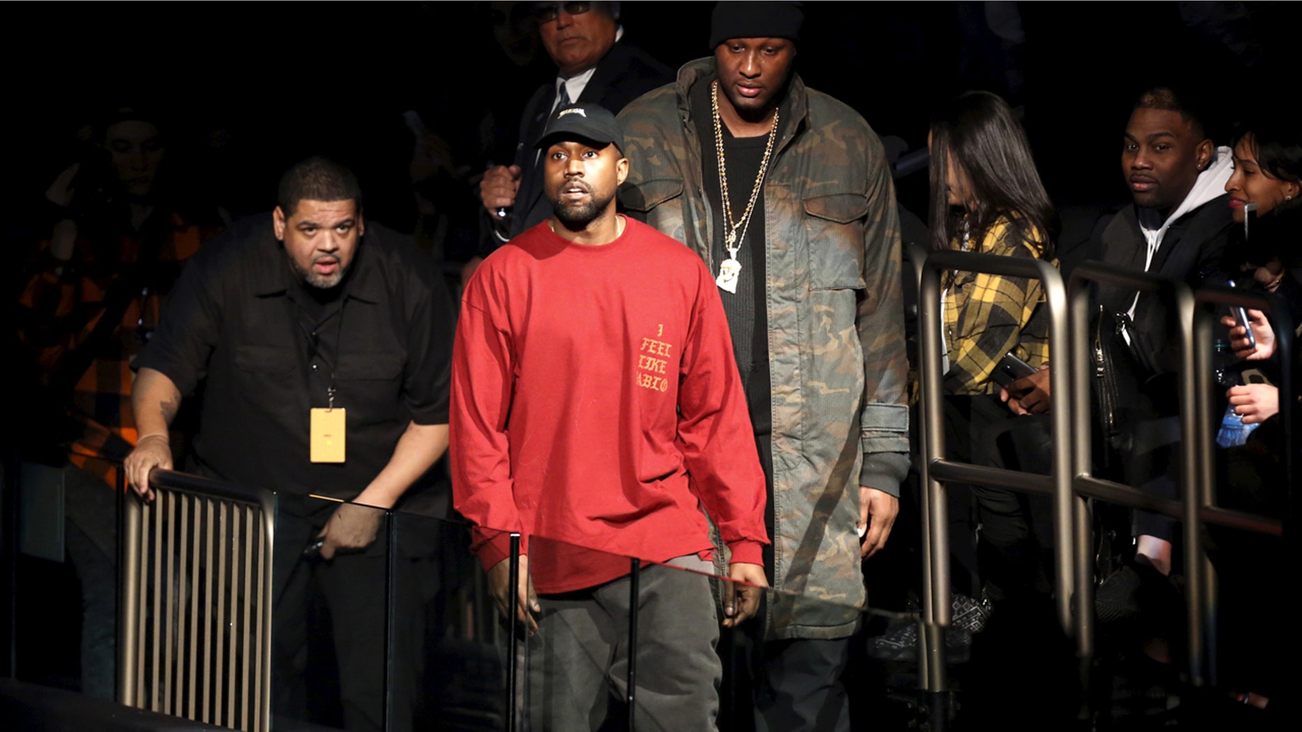 Kanye West (C) and Lamar Odom arrive at Kanye West's Yeezy Season 3 presentation and listening party for the new "The Life of Pablo" album during New York Fashion Week February 11, 2016.