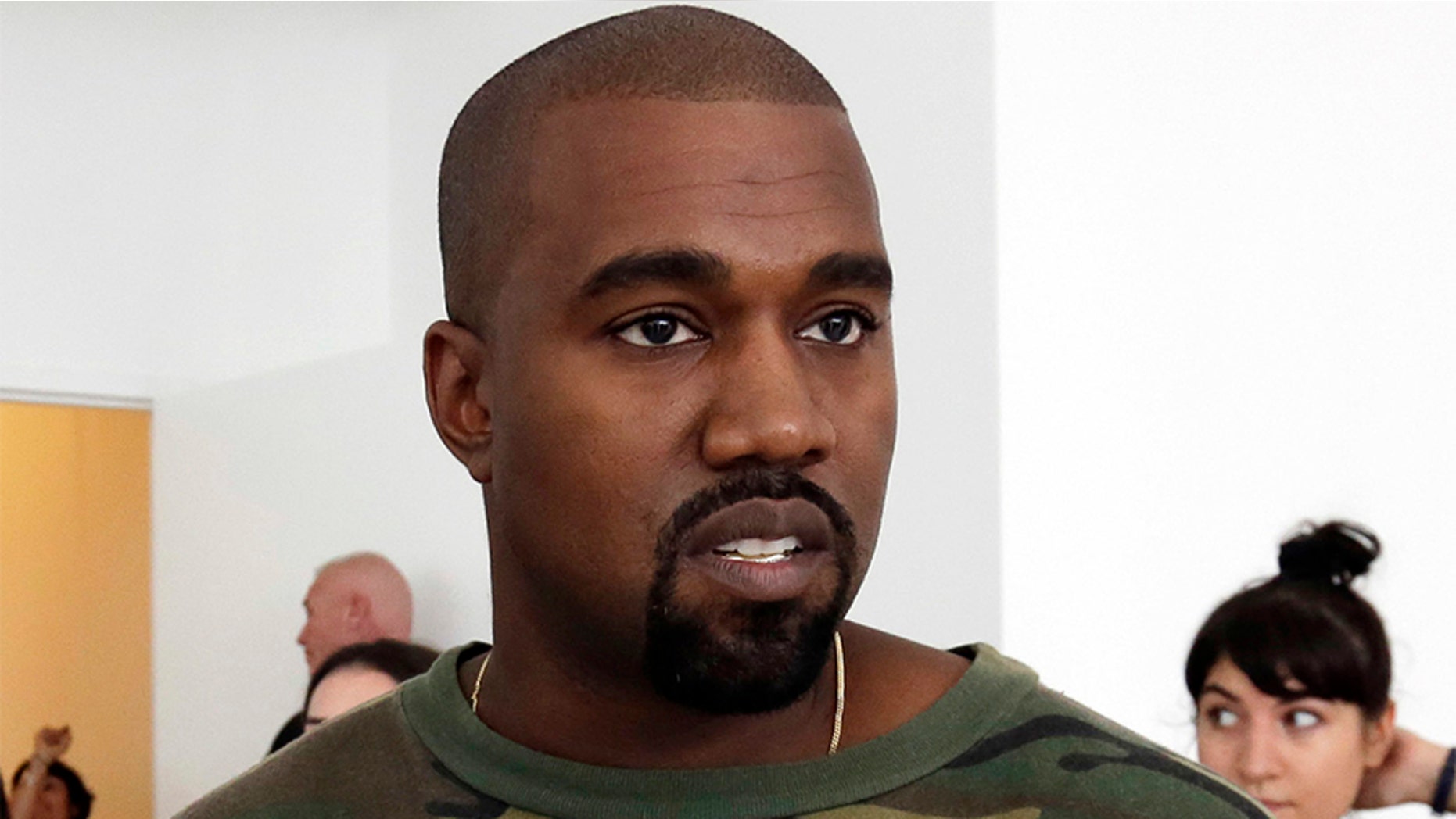 Kanye West explains his ill-fitting sandal choice after fans questioned why his sandals were too small on social media.