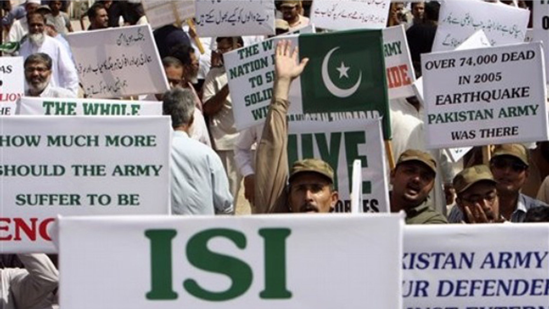 Members of a Pakistani civil society hold placards during a rally in support of Pakistan's army and the Inter-Services Intelligence agency, ISI, in Karachi, Pakistan May 14.