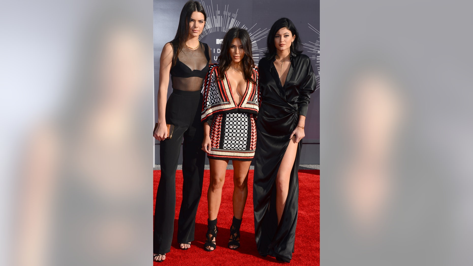 Between Kendall's (L) mom pants, Kim's (C) low cut poncho dress and Kylie's (R) way-too-big silk robe-like dress, these sisters need a new stylist pronto!