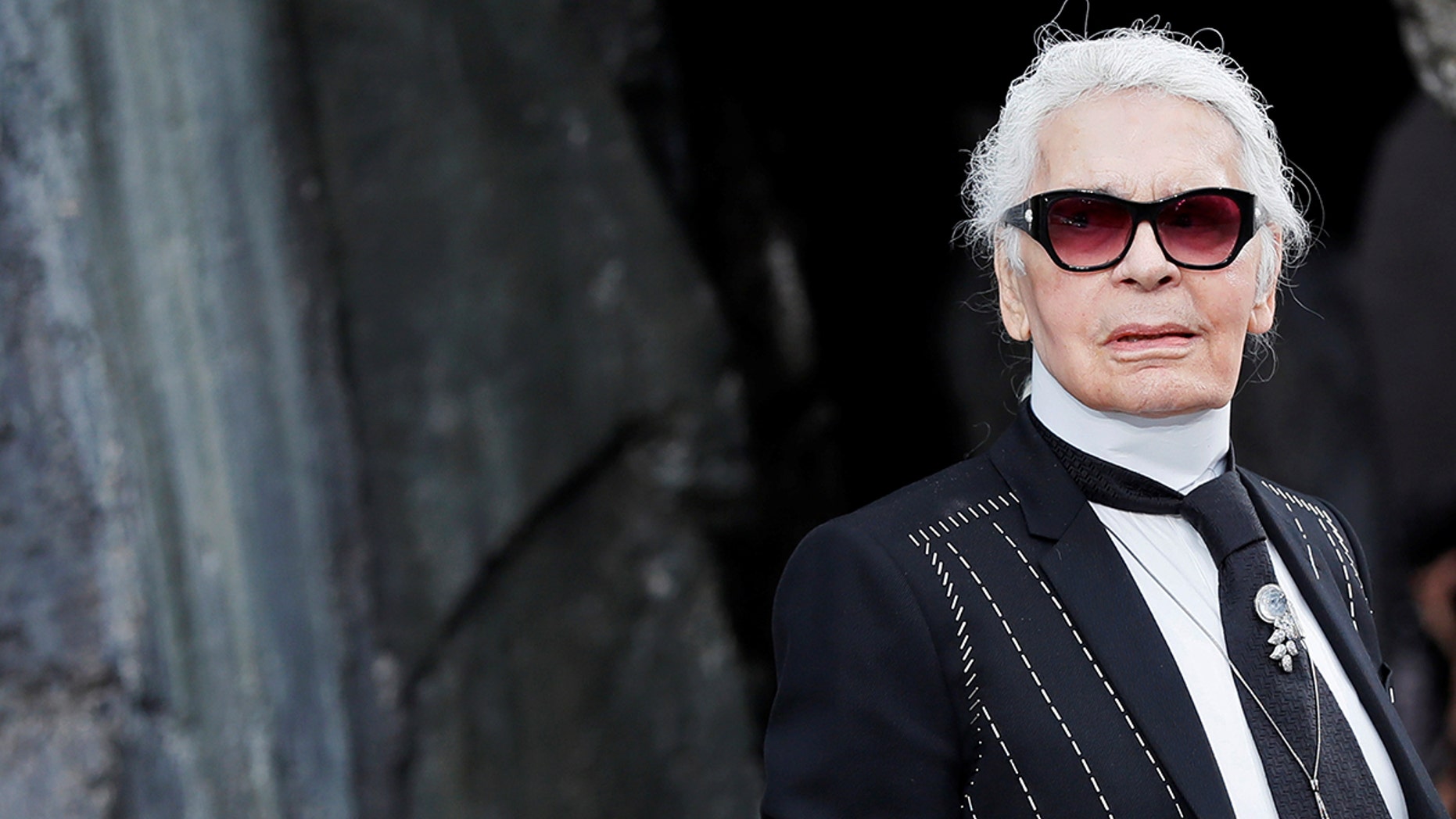 German designer Karl Lagerfeld appears at the end of his Spring/Summer 2018 women's ready-to-wear collection show for fashion house Chanel at the Grand Palais during Paris Fashion Week, France, October 3, 2017. REUTERS/Gonzalo Fuentes - RC18298D3B00