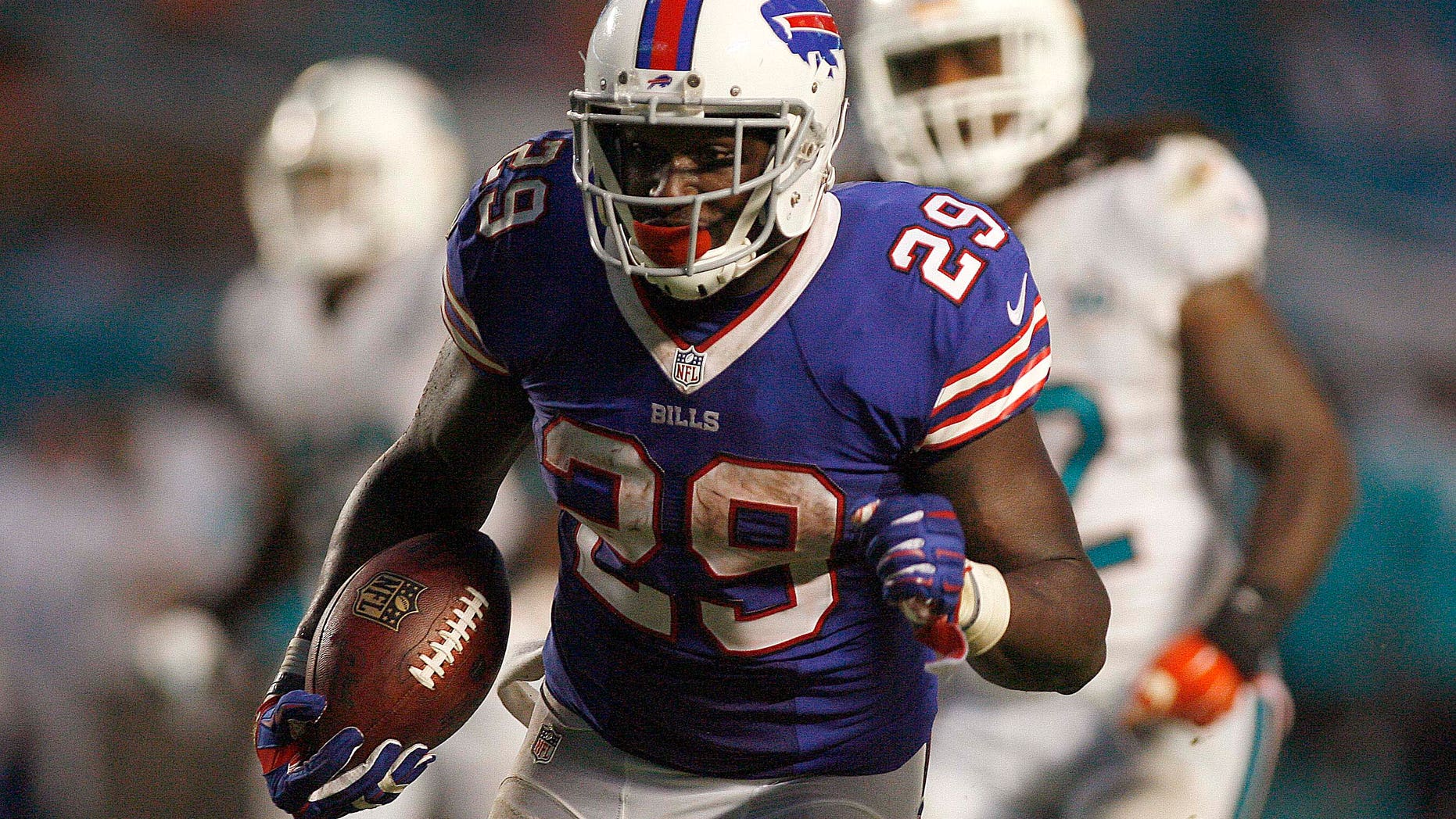 Sep 27, 2015; Miami Gardens, FL, USA; Buffalo Bills running back Karlos Williams (29) carries the ball in the second half against the Miami Dolphins at Sun Life Stadium.