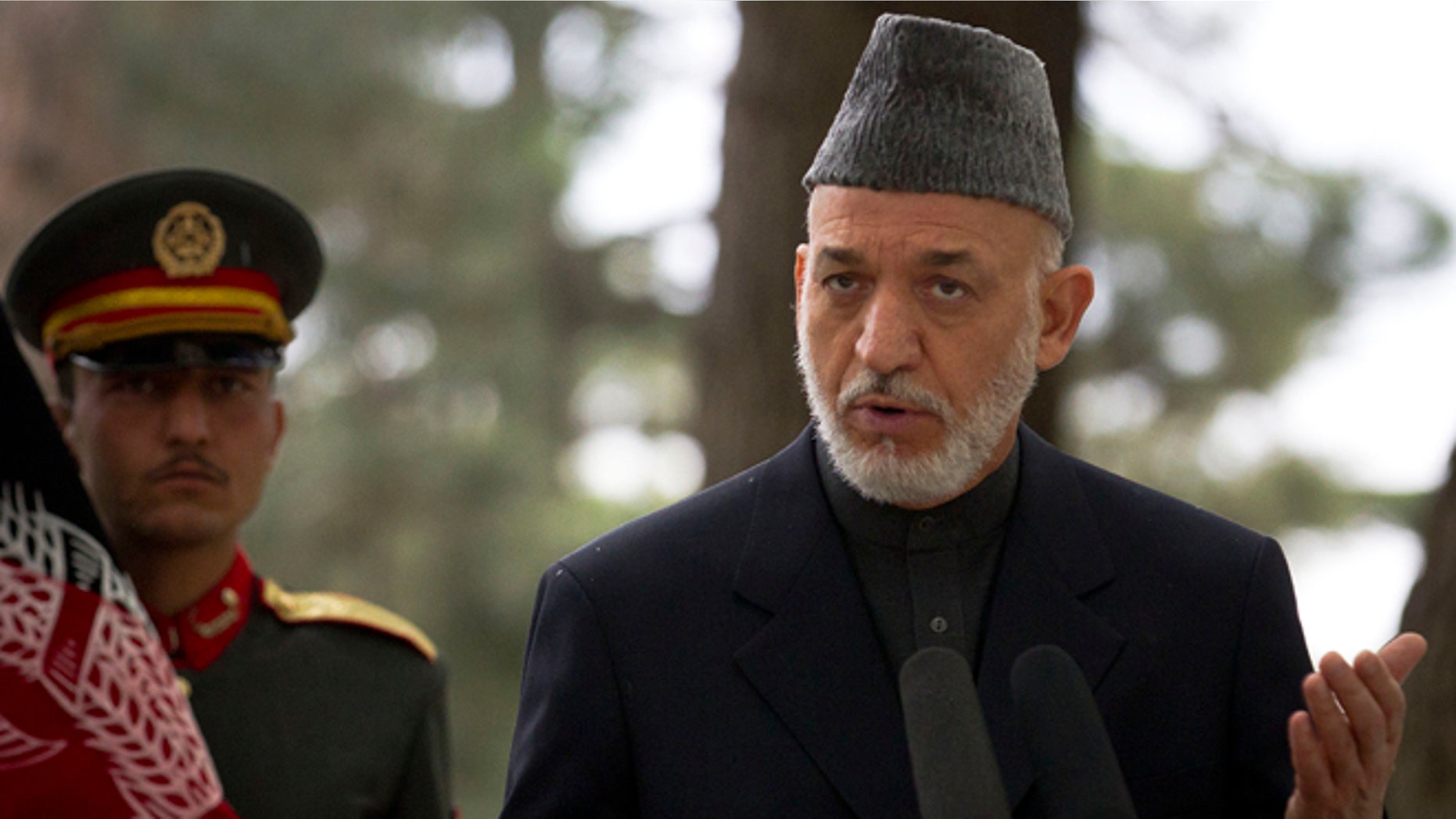 May 25, 2012: Afghan President Hamid Karzai gestures during a joint press conference wit French President Francois Hollande, unseen, in Kabul, Afghanistan.