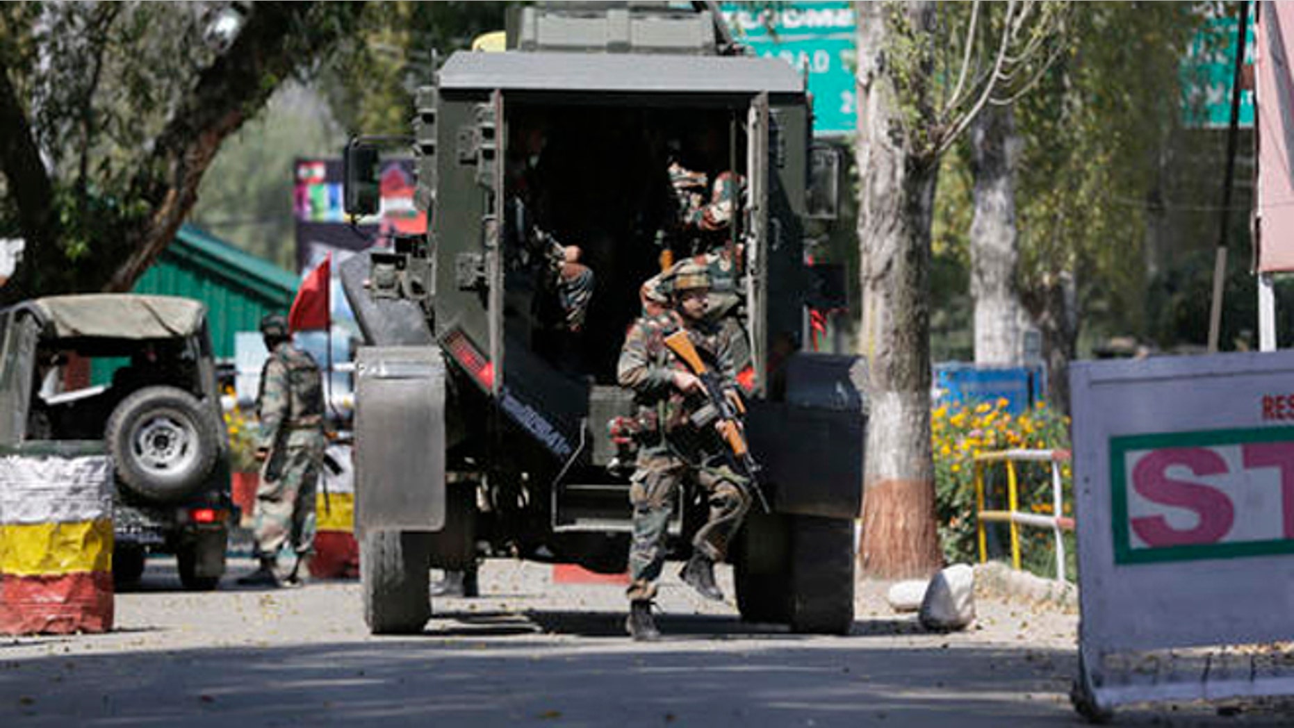 Indian army soldiers arrive at the army base which was attacked by suspected rebels in the town of Uri, west of Srinagar, Indian controlled Kashmir, Sunday.