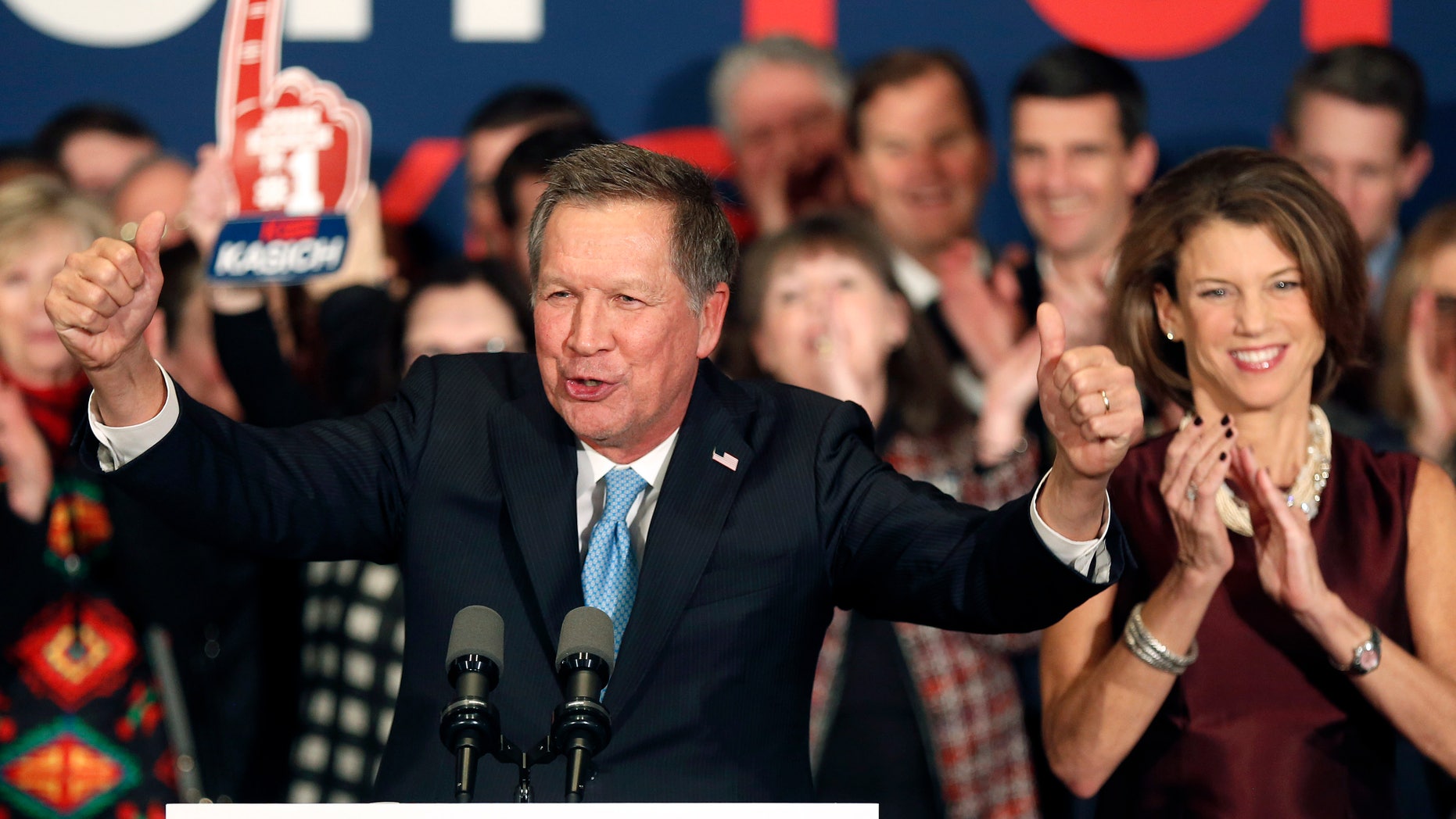 Gov. John Kasich cheers with supporters Tuesday, Feb. 9, 2016, in Concord, N.H.