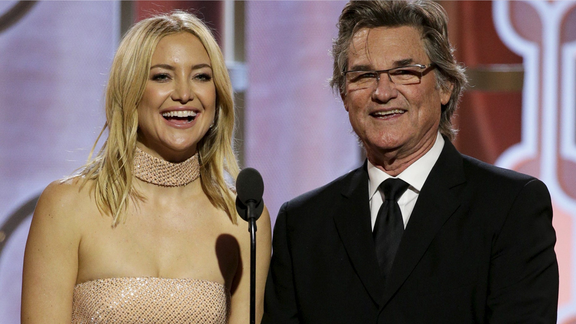 Kate Hudson and Kurt Russell present at the 73rd Golden Globe Awards in Beverly Hills, California January 10, 2016.
