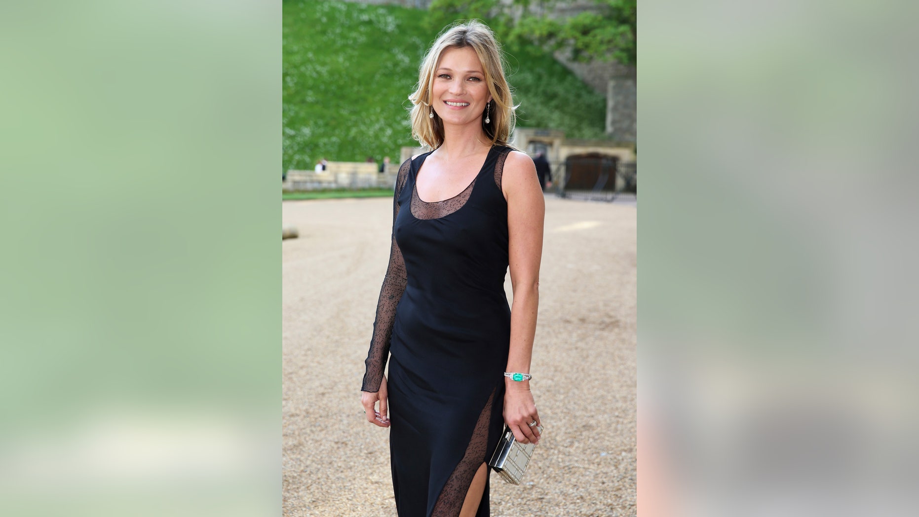 May 13, 2014. Model Kate Moss arrives for a dinner to celebrate the work of The Royal Marsden hosted by Britain Prince William at Windsor Castle, in Windsor.