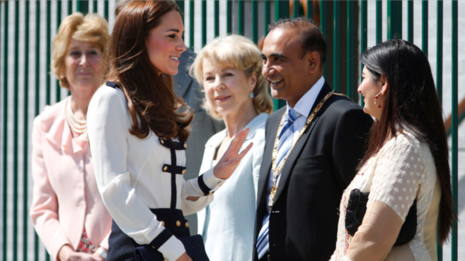 June 18, 2014: Britain's Kate, Duchess of Cambridge, foreground left, meets officials as she arrives for a visit at Bletchley Park, near Milton Keynes, England. (AP)