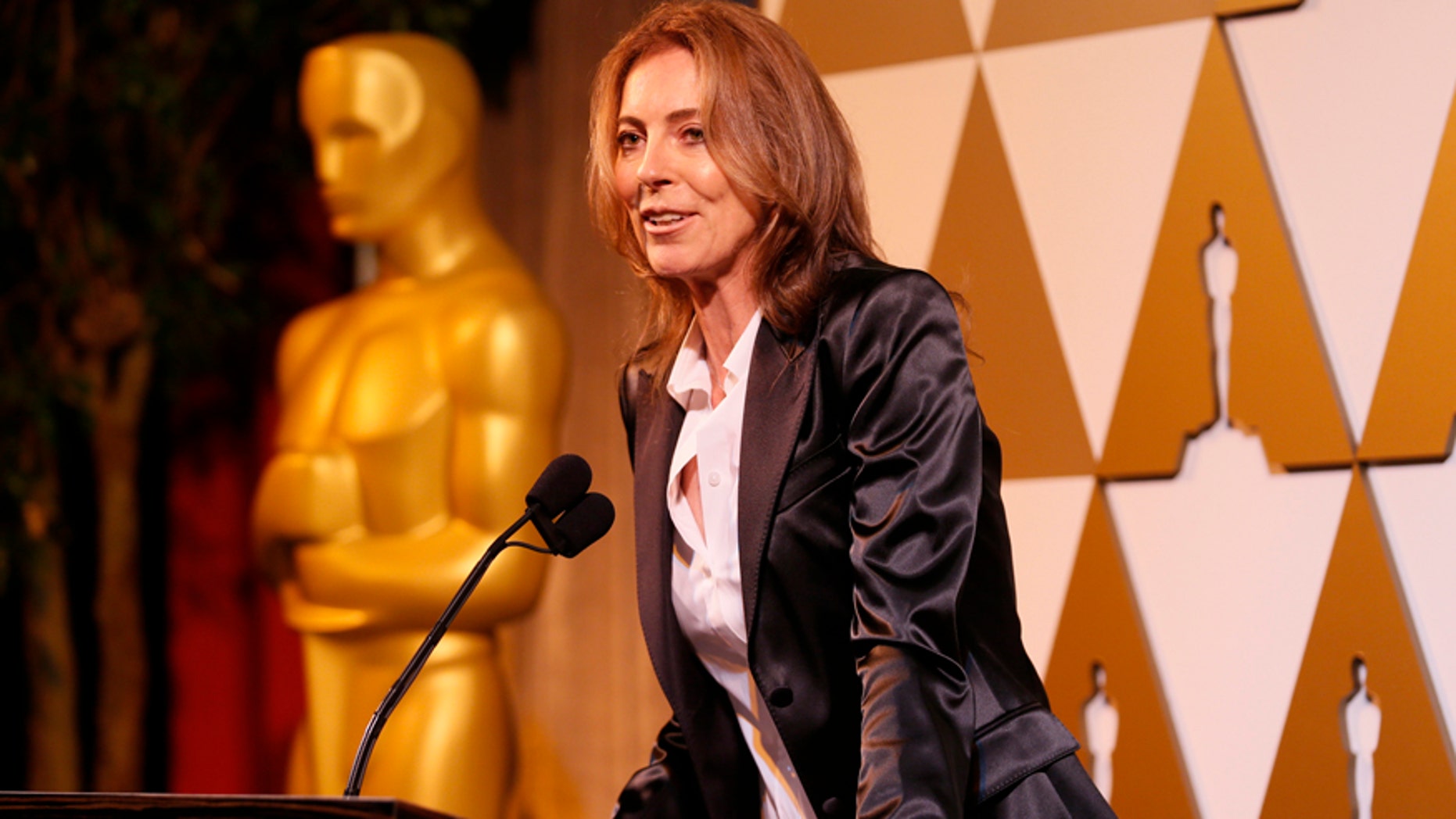 Director Kathryn Bigelow presents director Rithy Panh, whose Cambodian film "The Missing Picture" is nominated in the Foreign Language Film category, with a nomination certificate at the 86th Academy Awards Foreign Language Nominee Reception at Ray's and Stark Bar on the LACMA Campus in Los Angeles, February 28, 2014. REUTERS/Danny Moloshok (UNITED STATES - Tags: ENTERTAINMENT) - RTR3FUMG