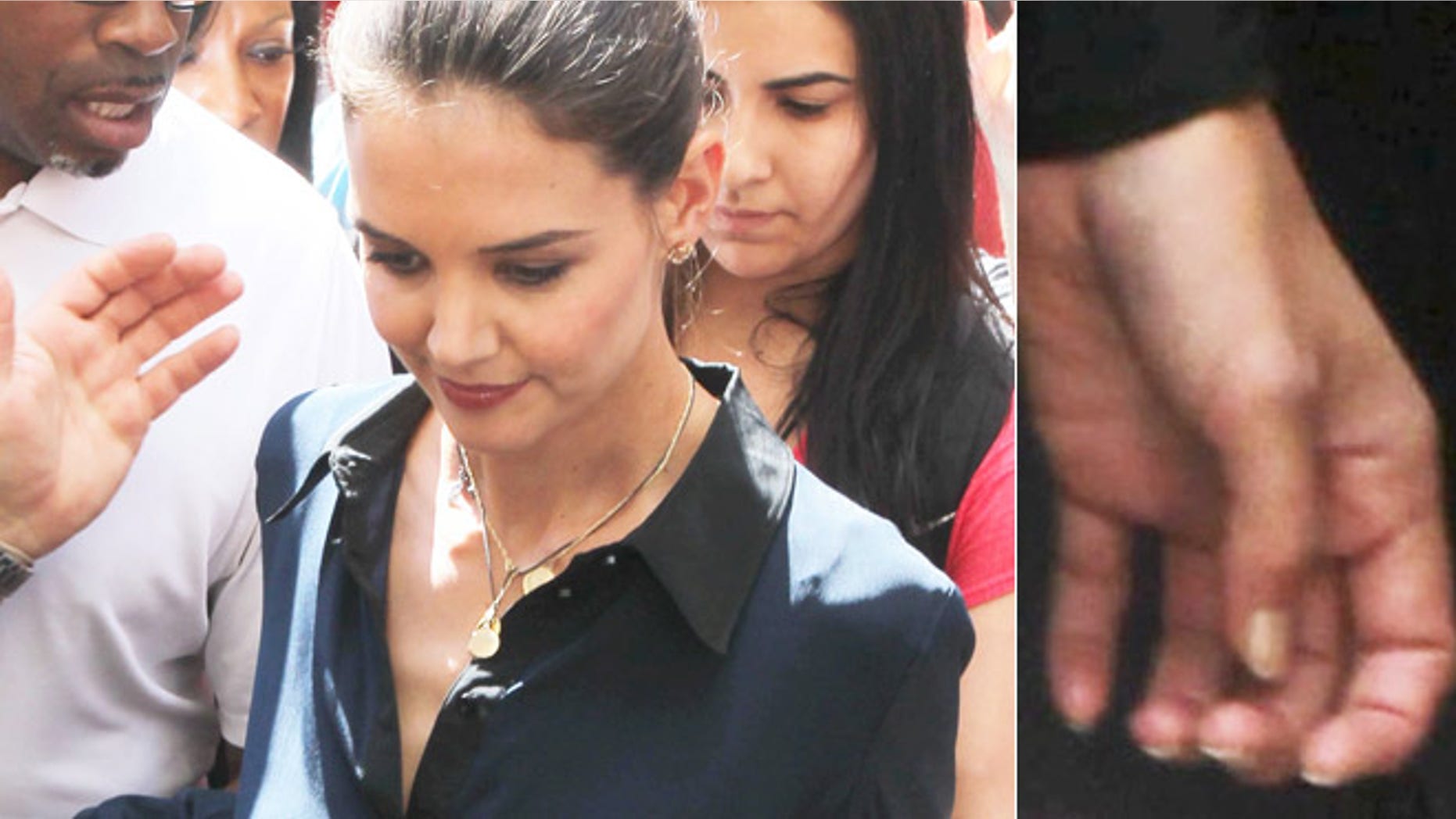 Katie Holmes is mobbed as she leaves her home to tape an episode of 'Project Runway,' sans wedding band, on July 2, 2012.
