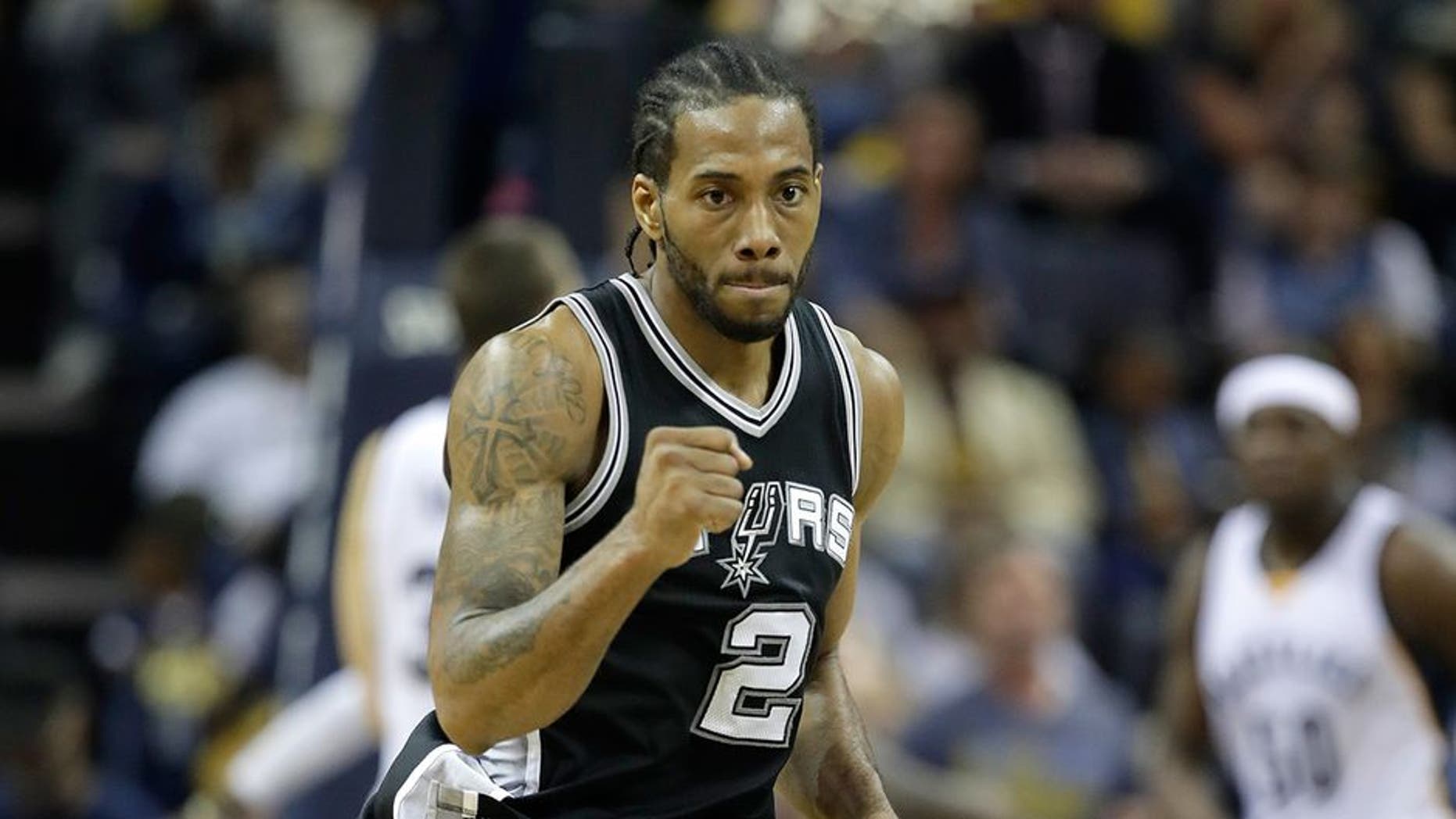 MEMPHIS, TN - APRIL 22: Kawhi Leonard #2 of the San Antonio Spurs pumps his fist after making a three point shot against the Memphis Grizzlies in game four of the Western Conference Quarterfinals during the 2017 NBA Playoffs at FedExForum on April 22, 2017 in Memphis, Tennessee. NOTE TO USER: User expressly acknowledges and agrees that, by downloading and or using this photograph, User is consenting to the terms and conditions of the Getty Images License Agreement (Photo by Andy Lyons/Getty Images)