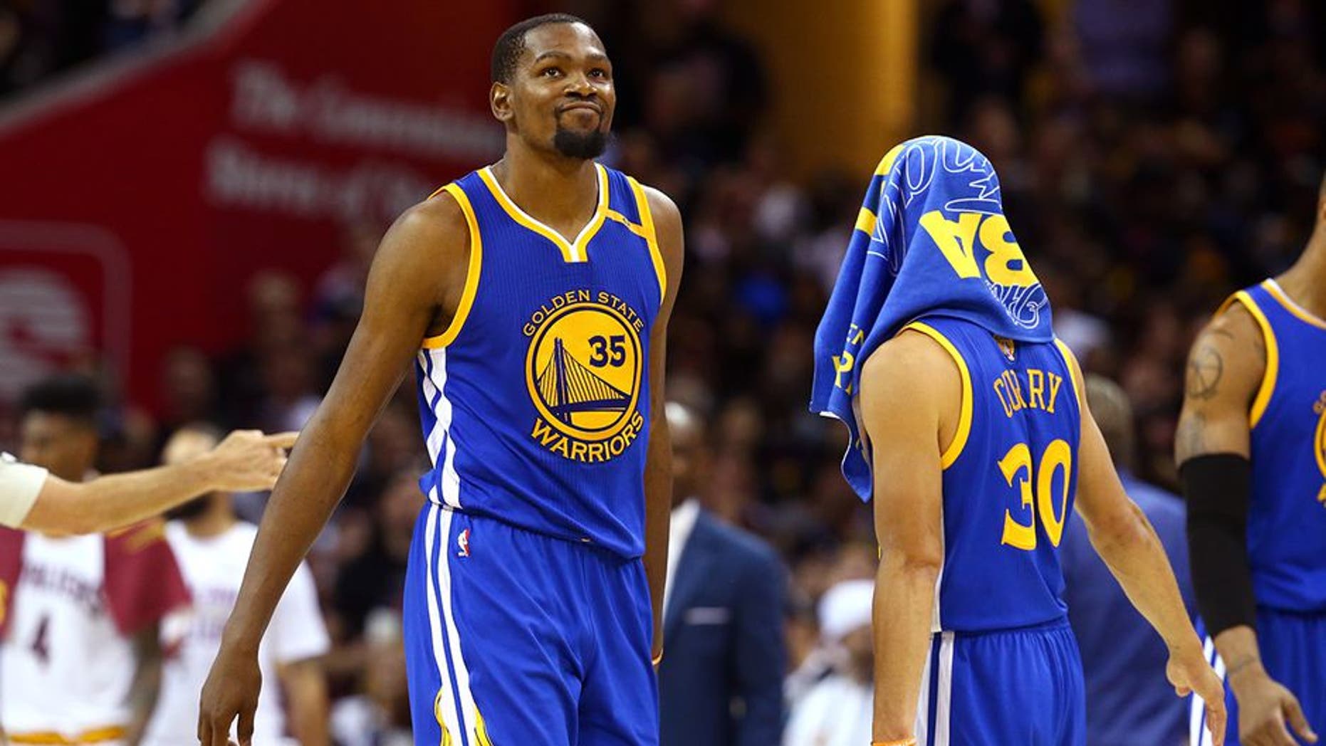 CLEVELAND, OH - JUNE 07: Stephen Curry #30 and Kevin Durant #35 of the Golden State Warriors react late in the game against the Cleveland Cavaliers in Game 3 of the 2017 NBA Finals at Quicken Loans Arena on June 7, 2017 in Cleveland, Ohio. NOTE TO USER: User expressly acknowledges and agrees that, by downloading and or using this photograph, User is consenting to the terms and conditions of the Getty Images License Agreement. (Photo by Ronald Martinez/Getty Images)