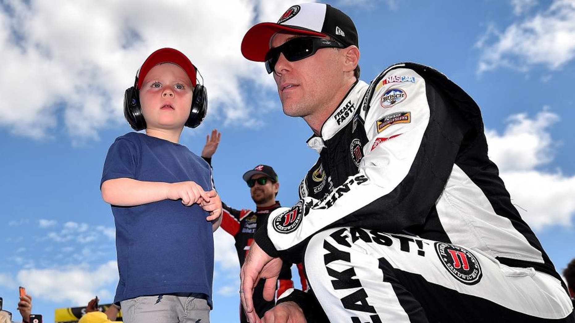 Feb 21, 2016; Daytona Beach, FL, USA; NASCAR Sprint Cup Series driver Kevin Harvick (4) and his son Keelan Harvick before the Daytona 500 at Daytona International Speedway. Mandatory Credit: Jasen Vinlove-USA TODAY Sports