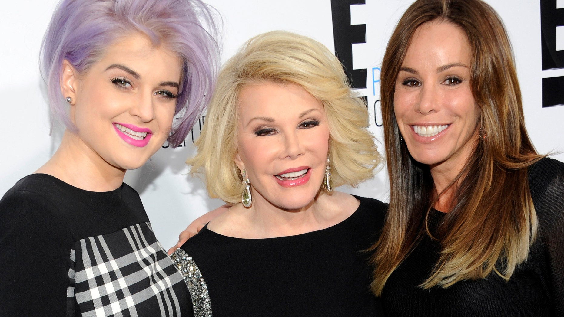April 30, 2012. Kelly Osbourne, left, and Joan Rivers, center, co-hosts of the show "Fashion Police" and show producer Melissa Rivers pose at an E! Network upfront event in New York.