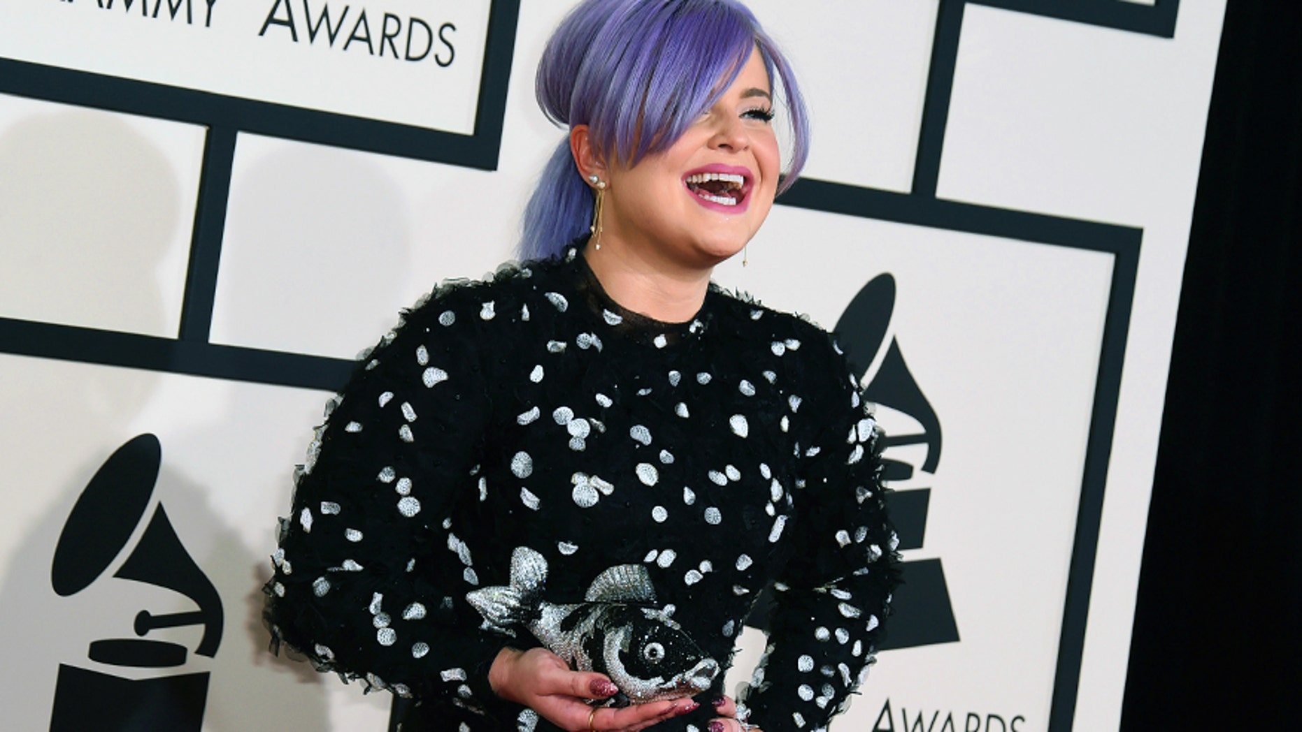 Kelly Osbourne arrives at the 57th annual Grammy Awards at the Staples Center on Sunday, Feb. 8, 2015, in Los Angeles.