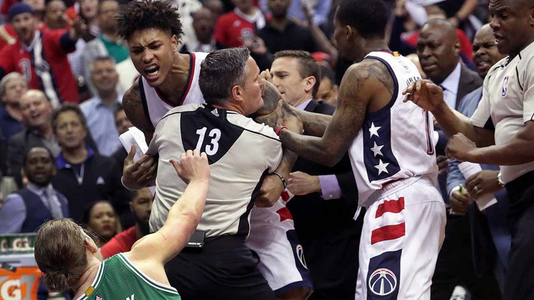 WASHINGTON D.C. - MAY 4: Tempers reach a boiling point as Washington Wizards forward Kelly Oubre Jr. (12) charges and knocks down Boston Celtics center Kelly Olynyk (41) during the second quarter. The Washington Wizards host the Boston Celtics in Game Three of the NBA Eastern Conference Semifinals at the Verizon Center in Washington, D.C. on May 4, 2017. (Photo by Barry Chin/The Boston Globe via Getty Images)