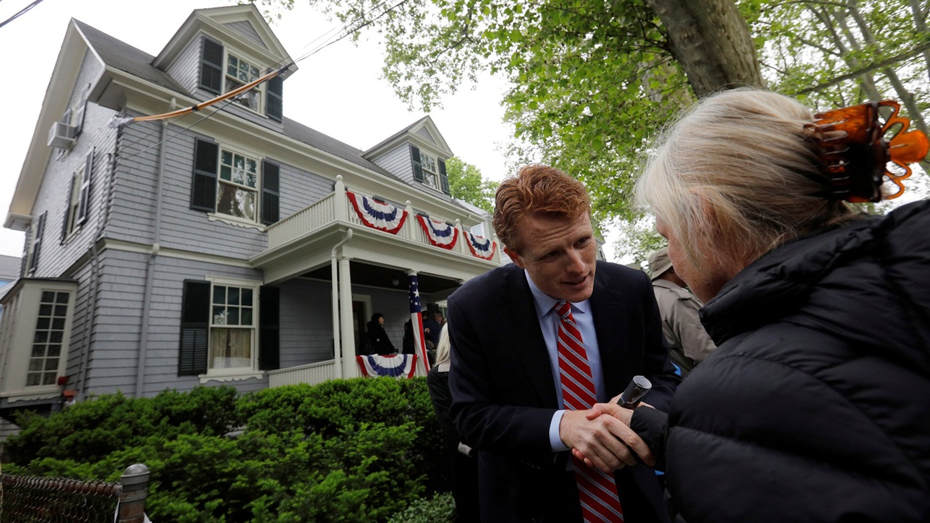 U.S. Rep. Joe Kennedy III greets a well-wisher during ceremonies on the 100th anniversary of the birth of his great-uncle, President John F. Kennedy, outside the home where JFK was born, in Brookline, Mass., May 29, 2017.