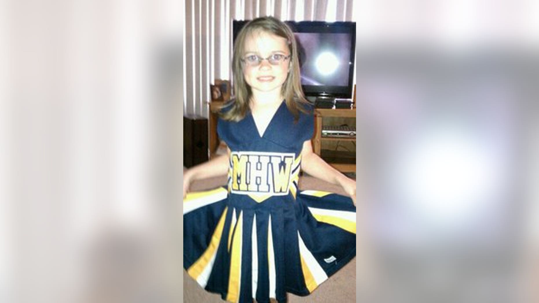 Jennifer and Duane Tesch, of Madison Heights, say their daughter, Kennedy, seen here, was unanimously voted off of the Madison Heights Wolverines flag football cheerleading team during a team meeting Tuesday night.