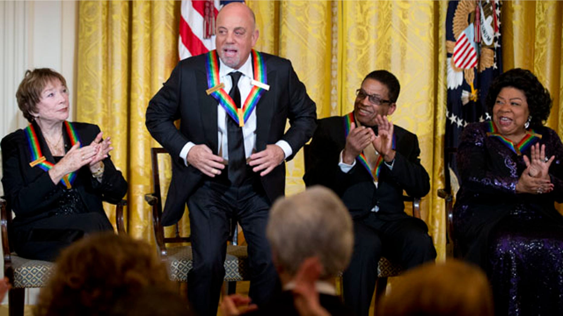 Dec. 8, 2013: Recipient of the 2013 Kennedy Center Honors, Billy Joel, second from left, stands and acknowledges the applause by fellow honorees Shirley MacLaine, left, Herbie Hancock, second from right, and Martina Arroyo, during a reception honoring the 2013 Kennedy Center Honors recipients.