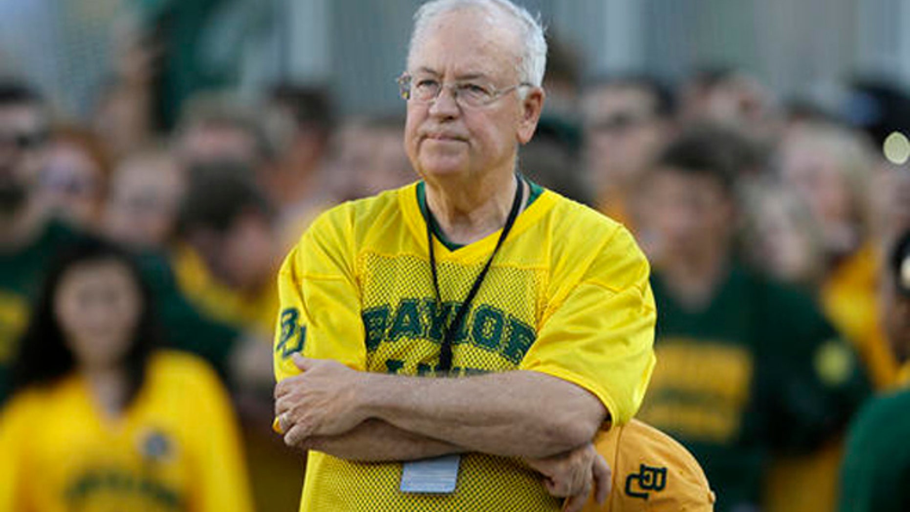 In the Sept. 12, 2015 file photo, Baylor President Ken Starr waits to run onto the field before an NCAA college football game in Waco, Texas.