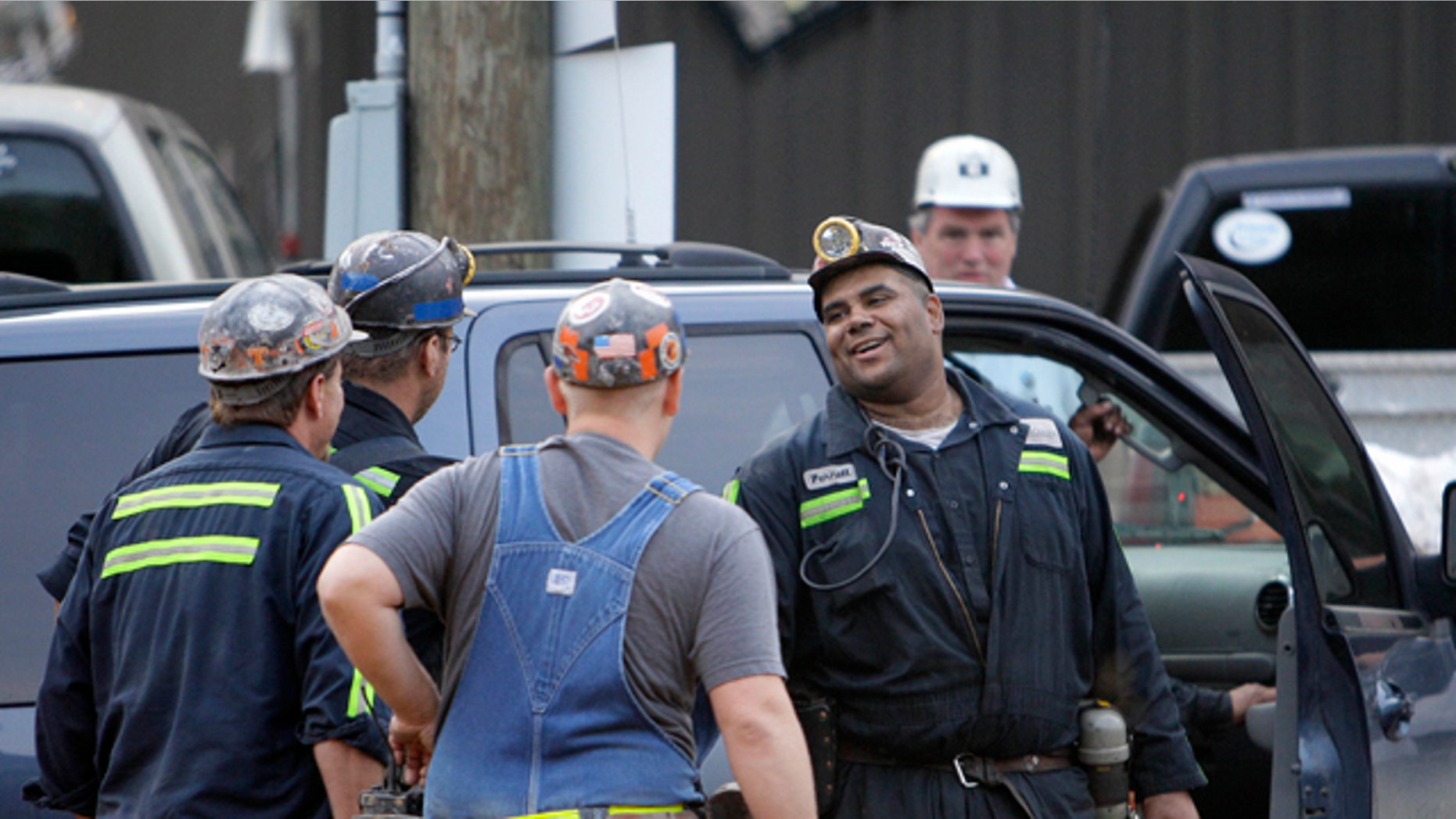 June 20: Pernell Witherspoon is congratulated after being rescued from within the Jellico Mine No 1. in Middlesboro, Ky. Three mine maintenance workers were freed and appeared to be in good health Monday after being trapped for 14 hours in the flooded southeastern Kentucky mine. (AP)