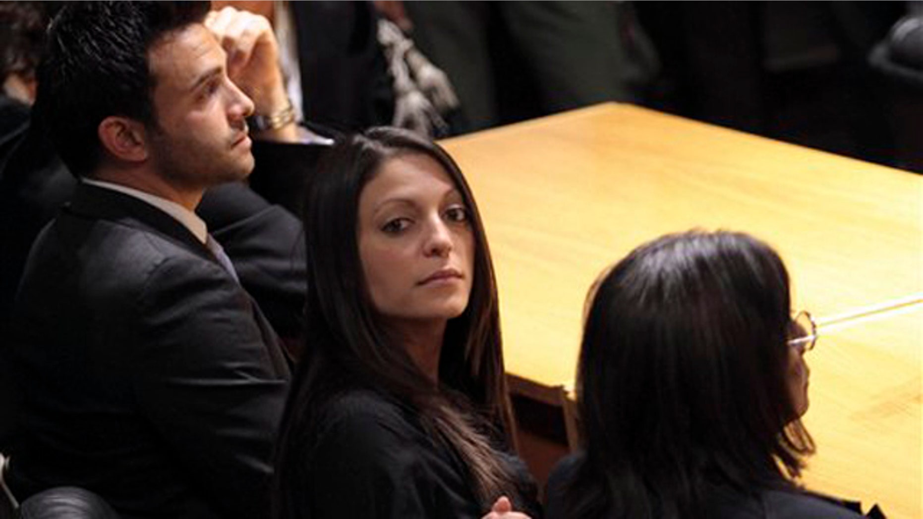 From left, Meredith Kercher's brother Lyle, sister Stephanie and mother Arline wait for the verdict in the Amanda Knox appeals trial at the Perugia court, Italy, Monday Oct. 3, 2011.