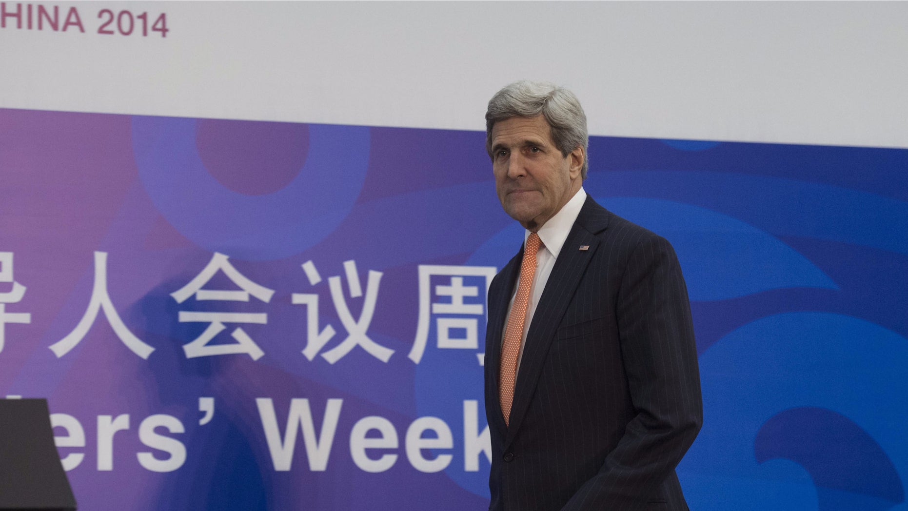 Nov. 8, 2014: U.S. Secretary of State John Kerry arrives to give a press conference at the Asia-Pacific Economic Cooperation