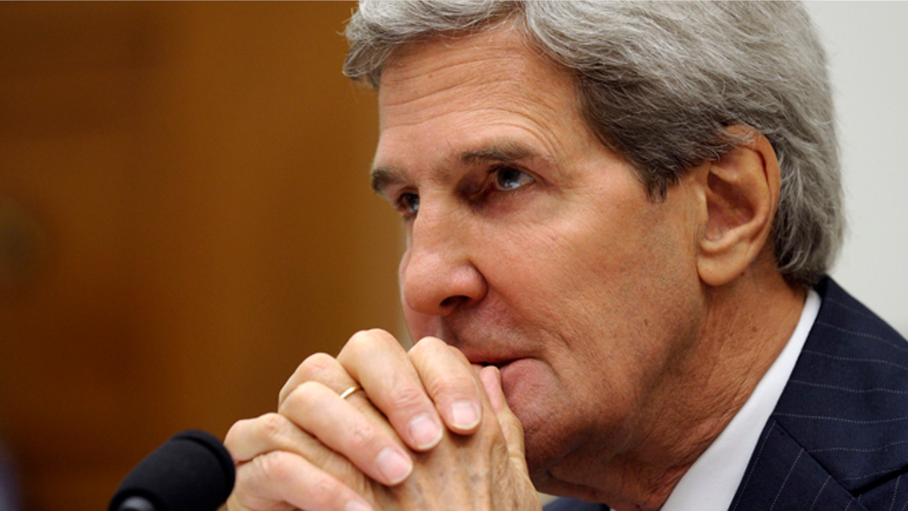 FILE: Sept. 10, 2013: Secretary of State John Kerry waits to testify on Capitol Hill in Washington, D.C.