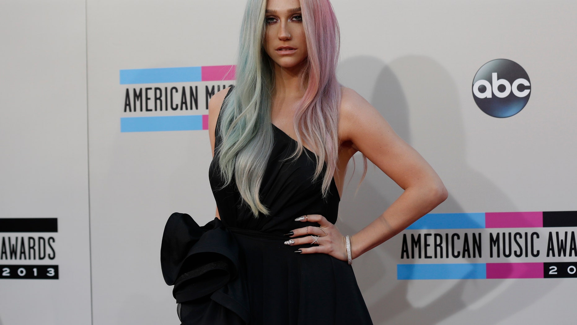 November 24, 2013. Ke$ha arrives at the 41st American Music Awards in Los Angeles, California.