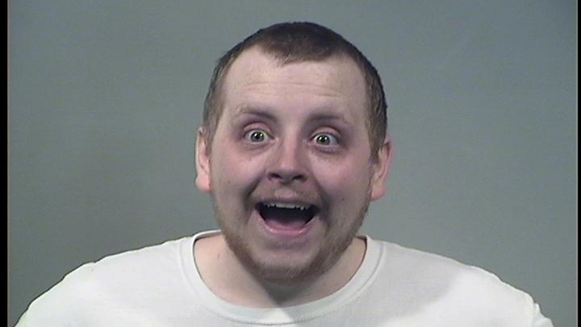 Kenneth Evans, 24, was arrested after attacking his girlfriend, at one point hitting her in the face with a pizza, police said.
