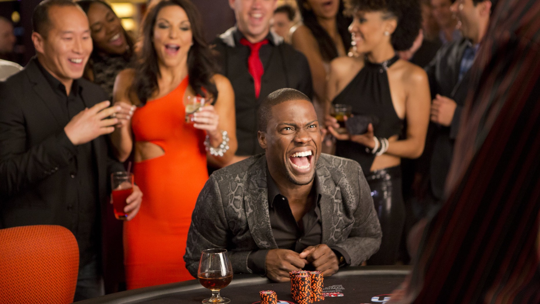 Kevin Hart, center, as Cedric in a scene from "Think Like A Man Too."