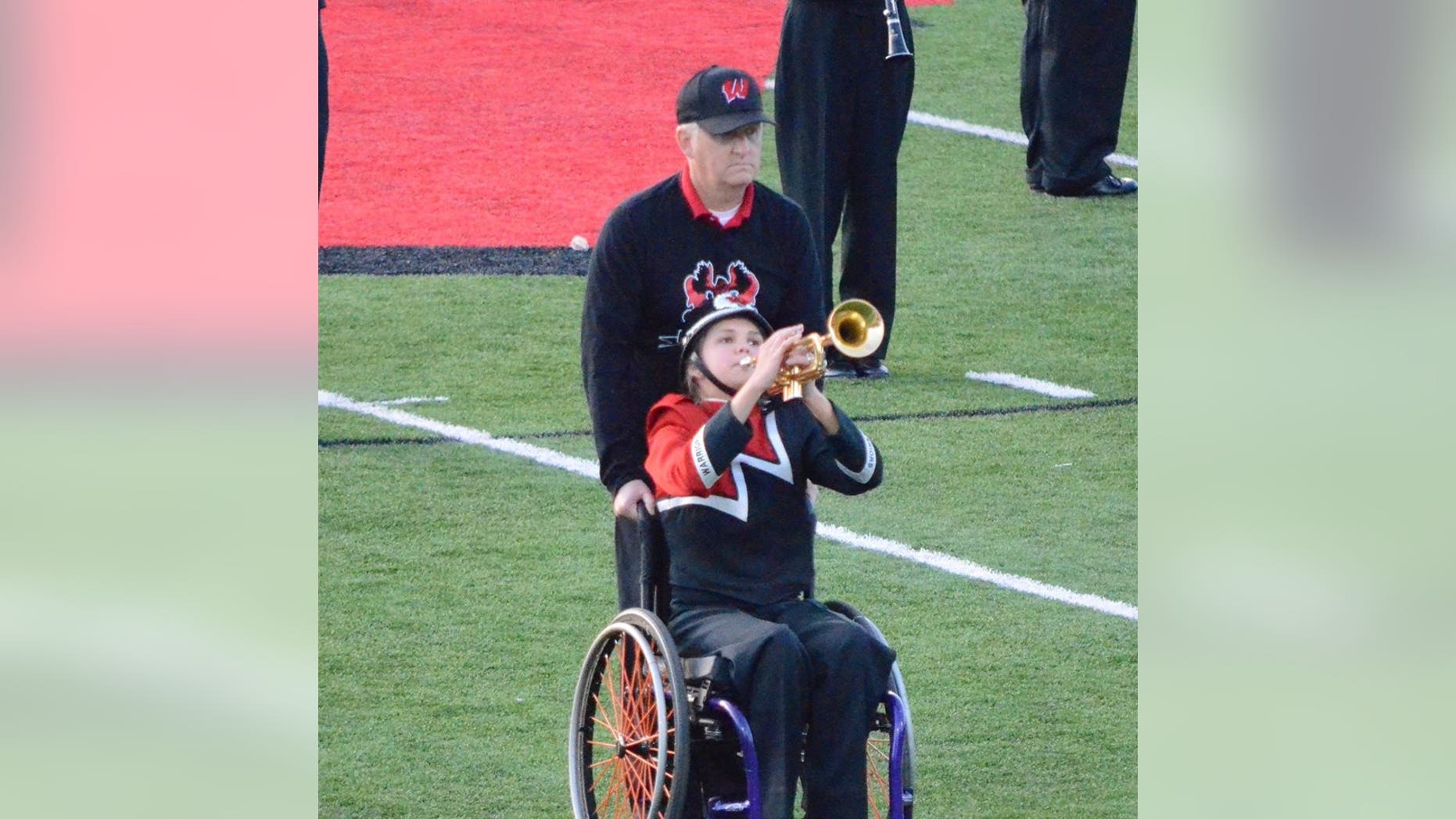 Kevin and Eva Houston perform during the marching band's halftime routine.