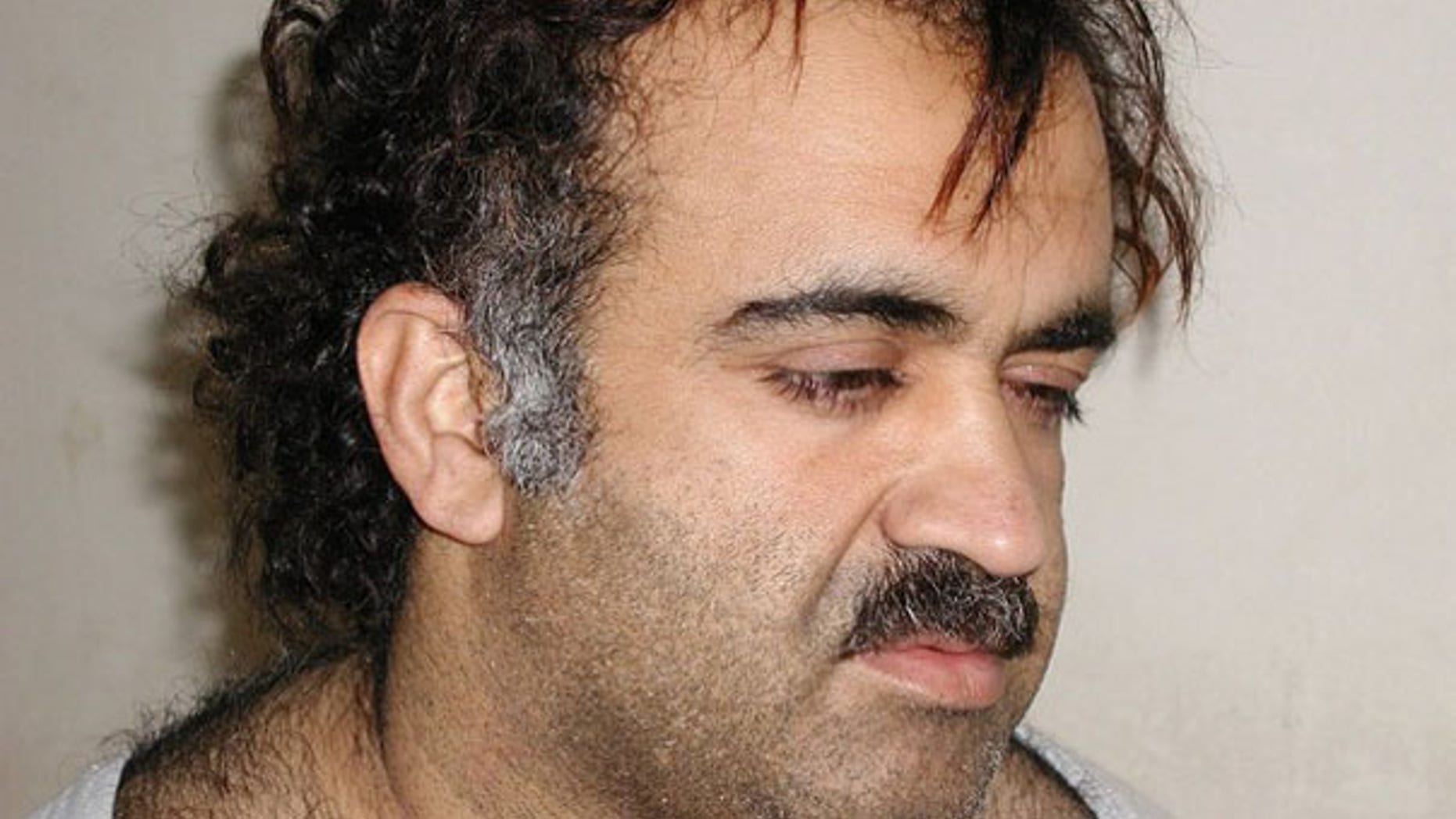 Khalid Sheikh Mohammed is shown in this file photograph during his arrest on March 1, 2003. (Reuters Photo)