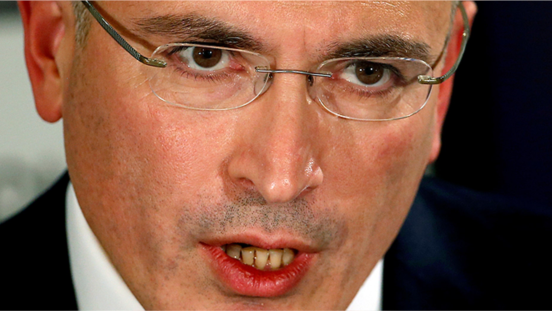 Mikhail Khodorkovsky speaks during a news conference in Berlin, Sunday, Dec. 22, 2013. The former oil baron and prominent critic of Russian President Vladimir Putin, Mikhail Khodorkovsky, was reunited with his family in Berlin on Saturday, a day after being released from a decade-long imprisonment in Russia. (AP Photo/Michael Sohn)