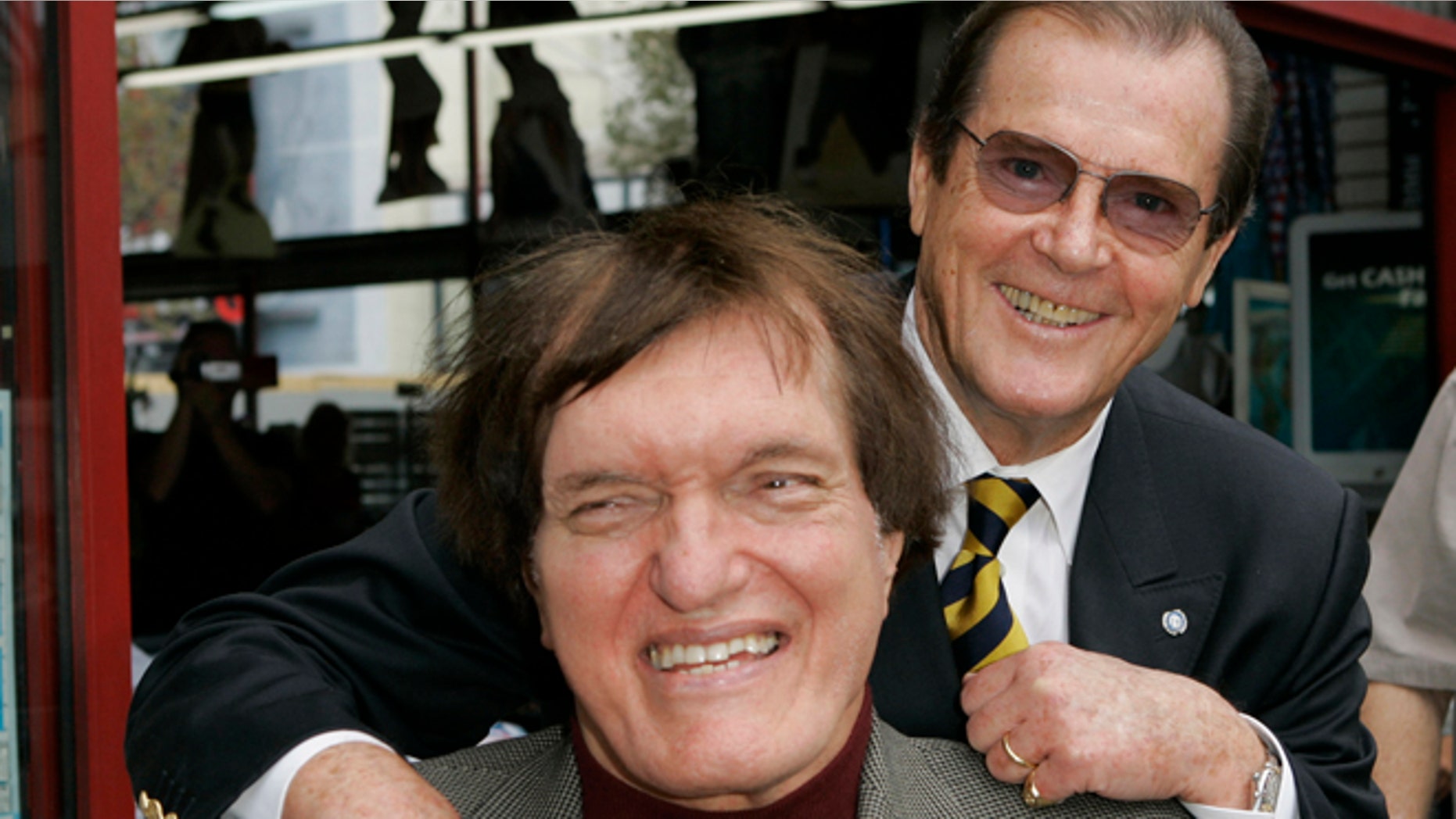 Oct. 11, 2007: Actor Roger Moore, right, who played the part of James Bond in seven films, poses with actor Richard Kiel, who played the role of Jaws in "The Spy Who Loved Me," during a ceremony honoring Moore with a star on the Hollywood Walk of Fame in Los Angeles.