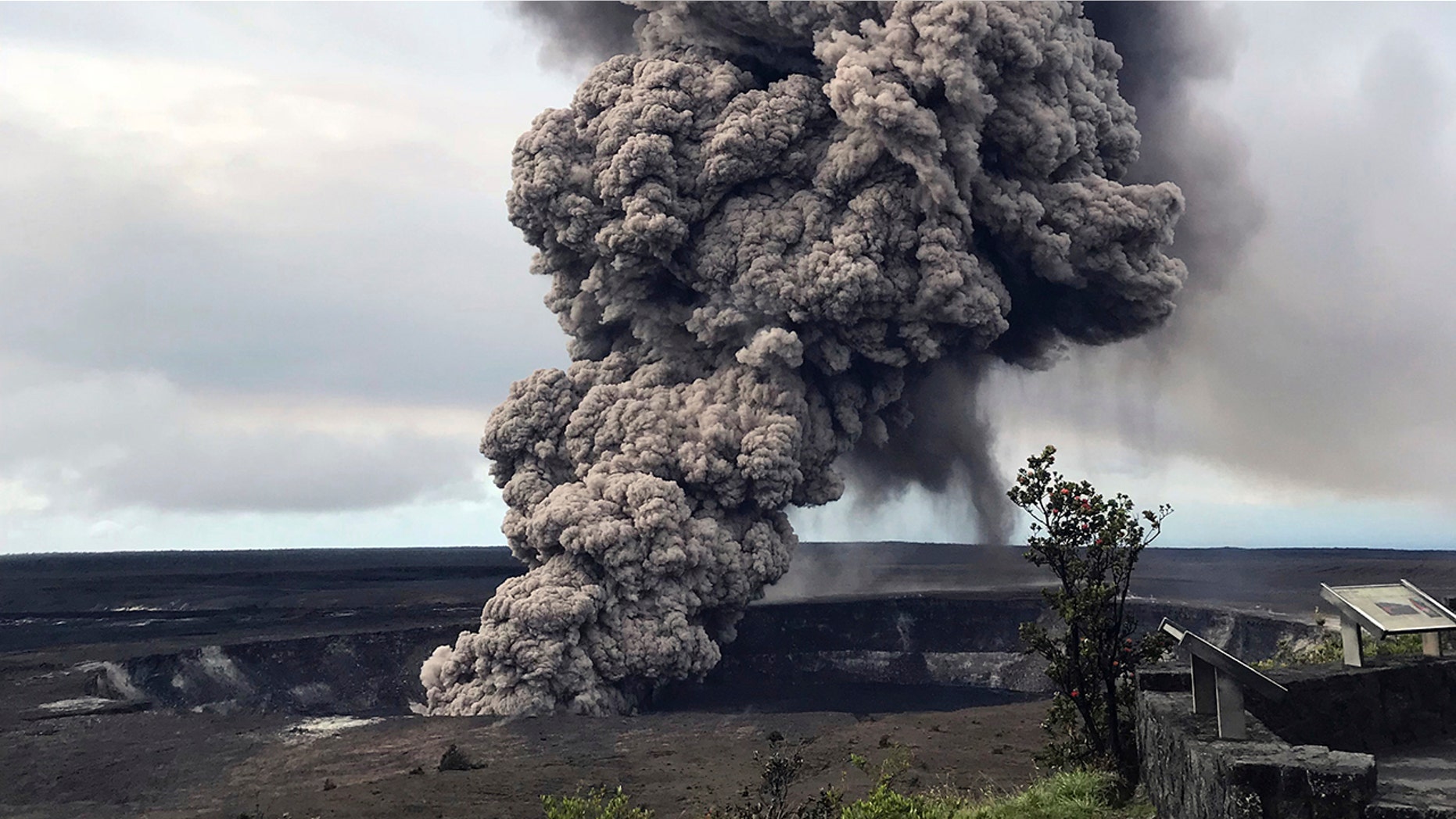 An ash column rises Wednesday from the overlook at Halema'uma'u Crater at the summit of Kilauea Volcano in Hawaii Volcanoes National Park on the island of Hawaii.