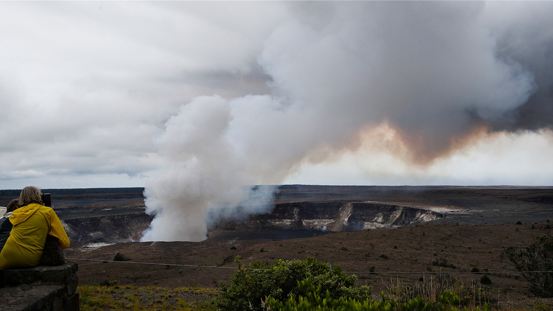 Steam and gas rise from Kilauea's summit crater in Volcanoes National Park, Hawaii, Wednesday, May 9, 2018. Geologists warned Wednesday that Hawaii's Kilauea volcano could erupt explosively and send boulders, rocks and ash into the air around its summit in the coming weeks. (AP Photo/Jae C. Hong)