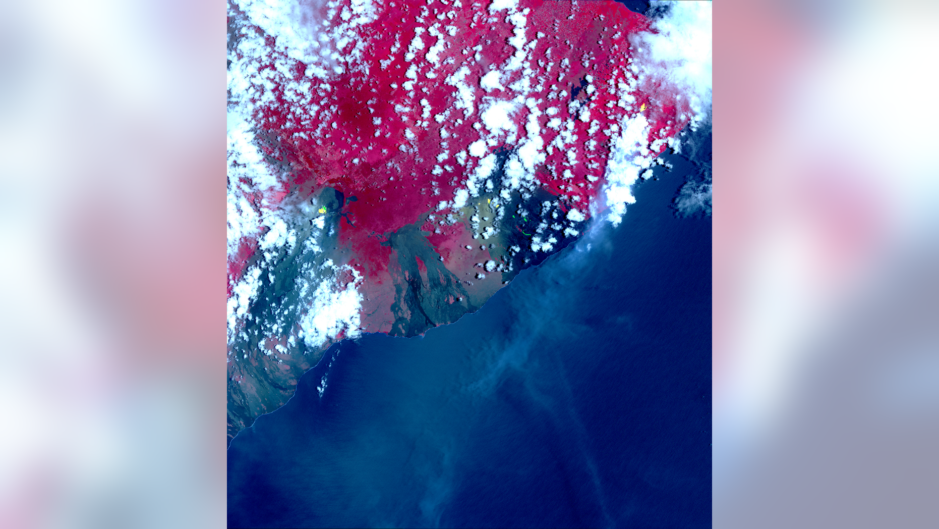 NASA's Terra satellite captured this image of Hawaii's erupting Kilauea volcano on May 6, 2018, using its Advanced Spaceborne Thermal Emission and Reflection Radiometer (ASTER) instrument. The yellow-green "hotspots" are newly formed fissures and lava flows; red is vegetation, and the gray-black areas are old lava flows.