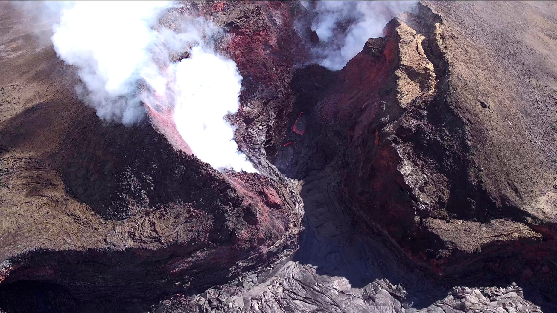 In this Aug. 11, 2018 aerial photo provided by the United States Geological Survey shows diminished volcanic activity on Kilauea's lower East Rift Zone.