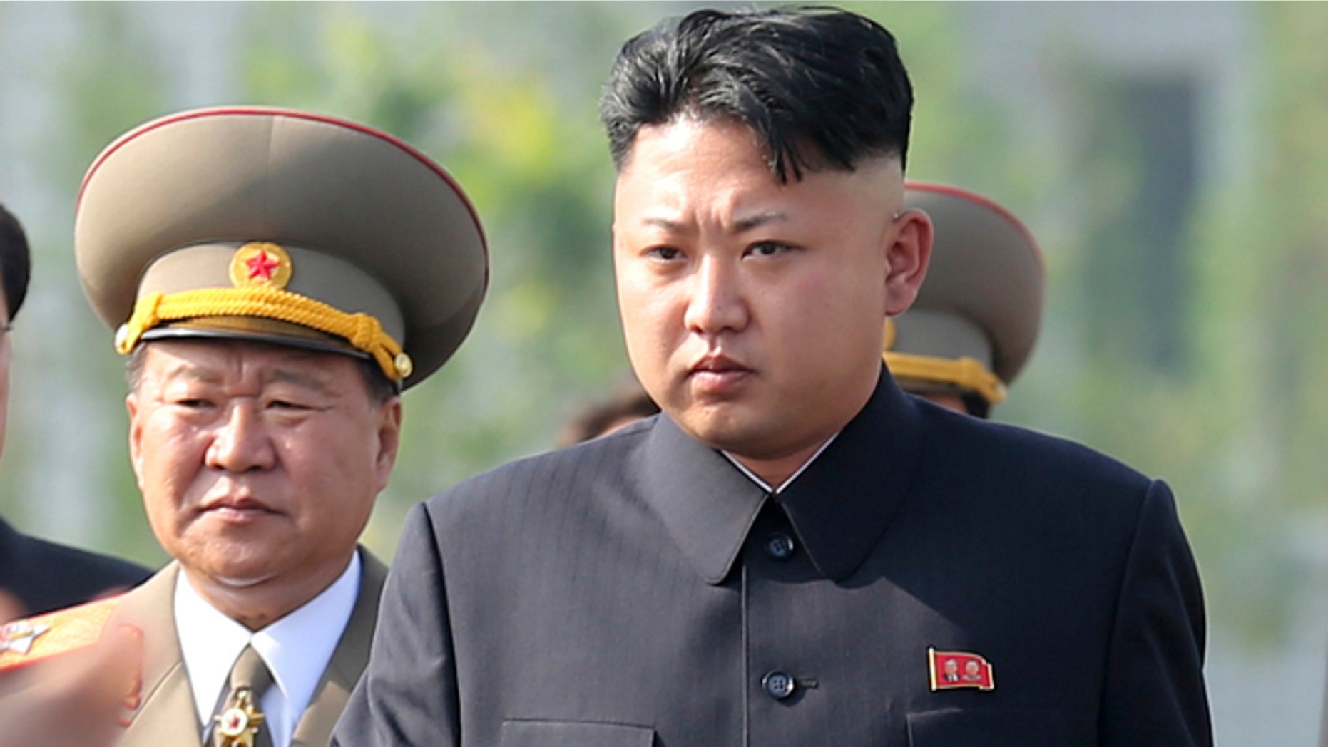 July 25, 2013: In this file photo, North Korean leader Kim Jong Un, center, arrives at the cemeteries of fallen fighters of the Korean People's Army (KPA) in Pyongyang, North Korea.