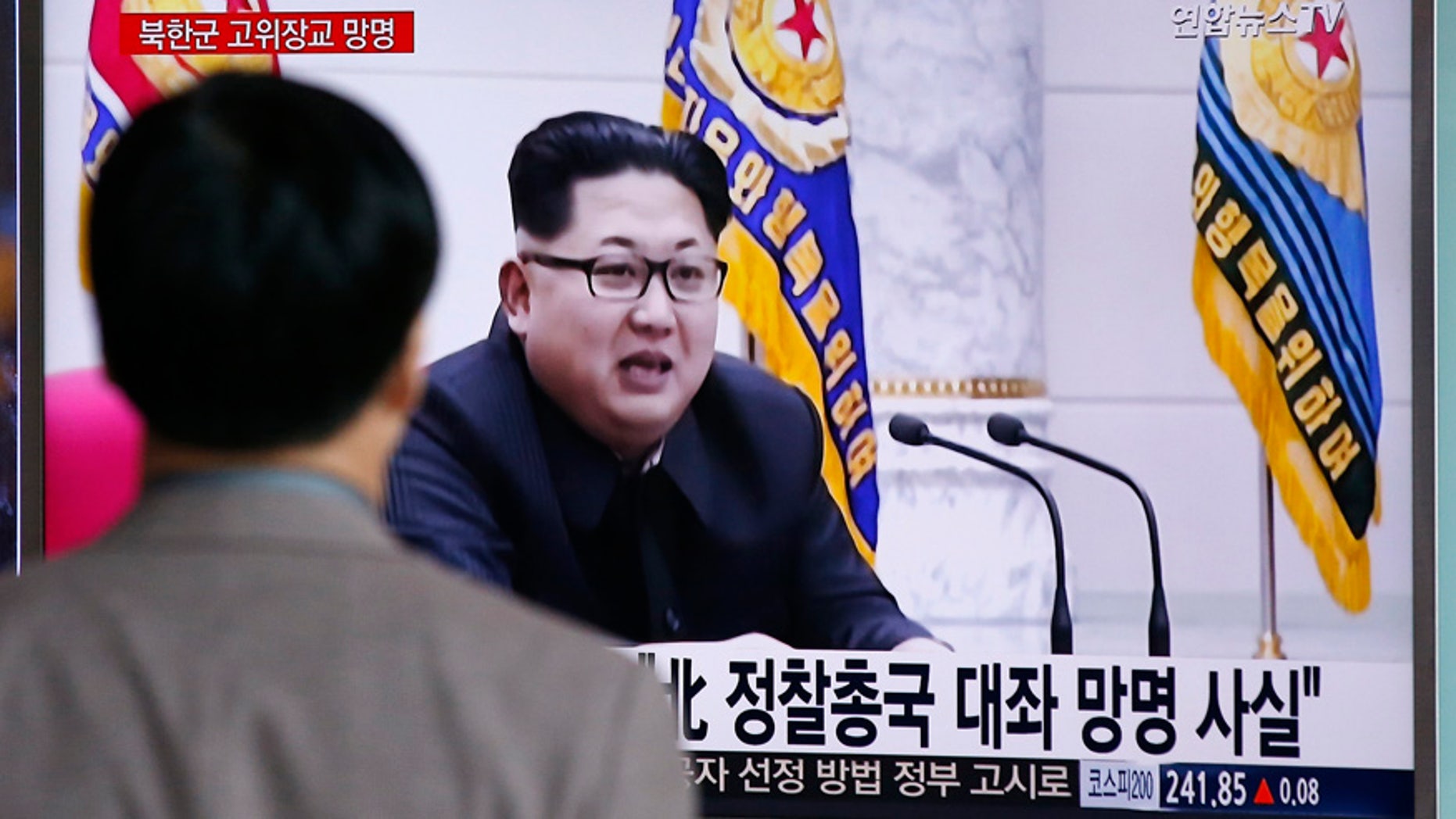 April 11, 2016: A man watches a TV news program showing file footage of North Korean leader Kim Jong Un at Seoul Railway Station in Seoul, South Korea
